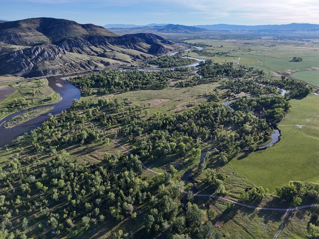 The Jefferson River Sporting Ranch is the epitome of a Montana riverfront ranch, boasting hundreds of acres of lush, wildlife-rich riparian bottomland, productive ranchland, recreational amenities, and outstanding views of the Bridger, Madison, and Tobacco Root mountains. The 423± acre property is nestled alongside approximately 1± mile of the Jefferson River, a few miles south of Three Forks, under 30 minutes from the Bozeman Yellowstone International Airport, and approximately 40 minutes from downtown Bozeman, Montana.
Perhaps the most unique aspect of the ranch is the lush, spring-laden bottomland along the Jefferson River. Here, springs, wetland complexes, and remnant river sloughs intertwine among hundred-year-old cottonwoods. The wildlife is prolific. A wide variety of waterfowl, including ducks (mallards, widgeon, blue-winged teal, cinnamon teal), Canada geese, and tundra swans, as well as geese, turkey, pheasant, eagles, sandhill cranes, and songbirds, are perpetually present. Big game, including whitetail deer, moose, and occasionally elk also call the ranch home.
The ranch is a blank slate with the opportunity to build a home or enjoy as a recreational retreat. Two suggested build sites with approved septic permits at each for five bedroom homes are already in place, allowing for a streamlined approach for a new owner to begin construction.
Jefferson River Sporting Ranch offers an unparalleled blend of outstanding wildlife habitat, productive ranchland, and convenient location, making it an ideal retreat for a new owner to create their own secluded, wildlife-rich oasis. The ranch is a clean slate, allowing for a new owner to build their legacy home or recreational retreat.