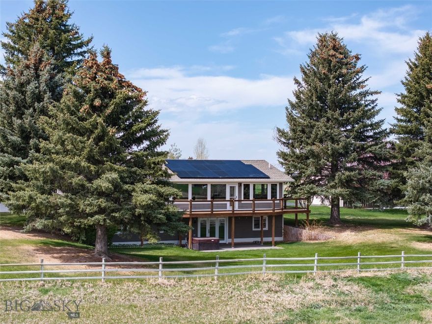Watts Lane is Bozeman’s best-kept secret—5 private, park-like acres framed by sweeping mountain views in every direction. Mature trees, manicured lawns, open horse pasture, corrals and a year-round tributary of Bozeman Creek create a rare Montana setting that feels both peaceful and remarkably close to town.
The 3,500± SF home features 4 bedrooms and 3 baths and was thoughtfully taken down to the studs and completely renovated in 2011, blending refined finishes with effortless indoor-outdoor living. A substantial shop with a 12-foot door, paved driveway and quiet country setting complete the property—all just minutes from downtown Bozeman and the airport.
Inside, a dramatic wall of windows draws the Bridger Mountains into the heart of the home. The main level is designed for gathering, with a generous mud room, hardwood floors, gas fireplace, custom kitchen with beautiful wood cabinetry and a large island, dining area, guest ¾ bath, private office with built-ins, and a primary suite with ¾ bath and walk-in closet. Off the main living space, a wrap-around deck is the ideal setting for entertaining, dining, and taking in the unobstructed views.
The walk-out lower level offers three additional bedrooms, a full bath, spacious family room with gas stove, laundry/craft room, mechanical room, and excellent storage. Enjoy the covered patio with a private hot tub. KitchenAid appliances were updated in 2020.
The grounds are beautifully established, thoughtfully maintained, and incredibly usable, with private yard space, mature landscaping, garden area with raised beds, pasture for horses, heated stock tanks, and even a resident flock of pheasants. Surrounded by open space and mountain views in every direction, the setting is private, peaceful, and distinctly Montana.