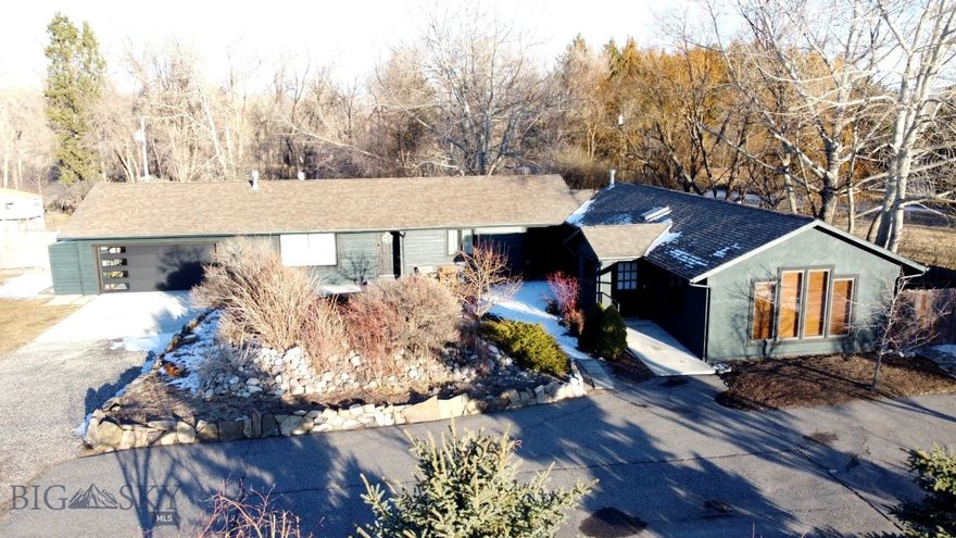 Your own private oasis in West Bozeman! This 4 bedroom 3 bath home with luxury updates offers a modern floor plan remodel and stunning oversized chef’s kitchen in a uniquely serene location located off a private access road close to fishing, golf and a straight shot to Big Sky and Yellowstone. Immaculately cared for, you'll enjoy a new oversized outdoor patio for entertaining, a fully fenced backyard with raised beds and mature plantings throughout the property.  Refinished hardwood floors and newer windows make this a turn-key versatile home for family living, work-live or the possibility of renting the second primary suite with separate entrance. Plenty of private parking for your boat or RV with no HOA checks the boxes if you are looking for privacy, low property taxes outside city limits, room to spread out with easy access to Bozeman and the airport. Make this your new Bozeman full-time home or keep it as an indulgent vacation retreat.