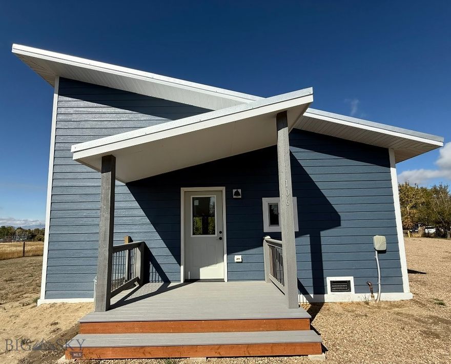 This charming, modern 2-bedroom, 2 bathroom home, built in 2022, offers 780 sq. ft. of thoughtfully designed living space on  0.27-acres on a serene and private access road shared by only 3 homes. You’ll enjoy a peaceful sense of community without the bustle of crowded developments.  Lived in for less than a year, this home is practically brand new. Move-in ready & designed for easy, comfortable living.
Step inside to discover a light-filled interior, thanks to expansive windows that invite the outdoors in. The open-concept kitchen features full-sized appliances, ample counter space, and seamless flow into the living area—ideal for entertaining or quiet evenings at home.
Breakfast bar  with a view! Kitchen & Laundry area feature vaulted ceilings, Living area features vaulted  ceiling  AND a ceiling fan.
Energy-efficient Mini split, heat pump for heating and cooling. On-Demand Water Heater. Home is on Town Water,  Sewer with Natural Gas & Fiber Optics Internet Service.
Perfect for coffee & taking in the stunning views from the low-maintenance, large Side-yard Deck, all Appliances included– Stacked washer/dryer, refrigerator, stove/oven, dishwasher and microwave.                        This special house is nestled in Sheridan, a great place to call Home, a perfect blend of tranquility, community, with local services one needs  & more – ex. Ruby Valley Medical Center  Schools, Senior Center, Brewery & eateries.
Whether you’re looking for a full-time residence, short-term rental, a weekend getaway, or a peaceful retreat, this property offers all these options.