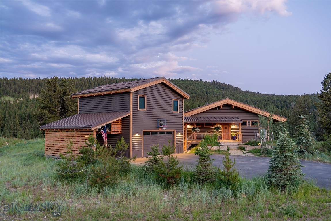 Nestled in the heart of Big Sky, this stunning mountain modern chalet offers the perfect blend of luxury, comfort, and convenience. The 3-bedroom, 3.5-bath main house is designed for both grand entertaining and cozy retreats, featuring a spacious vaulted great room with exposed wood timbers, a Tulikivi soapstone fireplace, and high-end modern appliances and finishes throughout.
A separate 2-bedroom, 1-bath ADU provides additional space for guests. Step outside onto the large covered wrap-around deck and take in the serene creekside setting, with peaceful backyard views and a private trail leading to South Fork Creek. Despite its tranquil feel, this home is just steps from Town Center, where Big Sky’s best dining, shopping, and entertainment await.
Offered turn-key furnished, this is a rare opportunity to own a quiet, private escape with all the action just moments away.