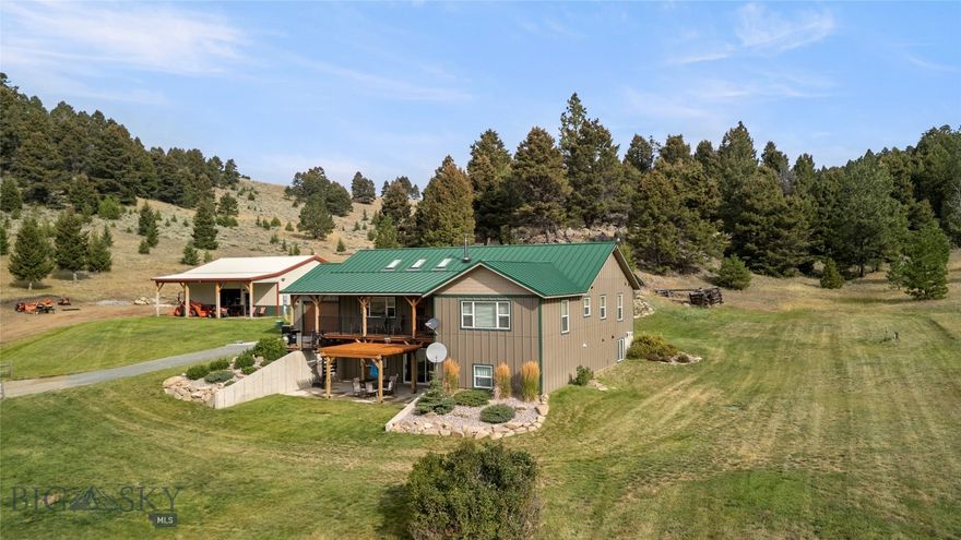 Set on 20 pristine acres with truly unforgettable views, this custom-built 2018 home offers a rare blend of privacy, functionality, and direct access to Montana’s great outdoors. Bordering State Land, BLM, and Forest Service ground, you’ll enjoy seamless access to thousands of acres right out your back door. Located in the highly desirable Aspen Valley Ranch subdivision in Boulder, MT—conveniently positioned between Helena and Butte—this 4-bedroom, 3-bath home is thoughtfully designed for comfortable main-level living. The open floor plan features a chef’s kitchen equipped with a Thermador oven and convection microwave/oven, flowing effortlessly into the main living spaces—perfect for both everyday living and entertaining. The primary suite captures the sweeping views, creating a peaceful retreat, while the expansive family room offers additional space to gather, complete with sliding glass doors that open to a patio and pergola—an ideal setting to take in the surrounding landscape. Outdoor living truly shines here, with wide-open space, incredible vistas, and room to enjoy it all. A 1,200 sq ft heated shop with an office and oversized doors provides incredible space for vehicles, equipment, or hobbies.