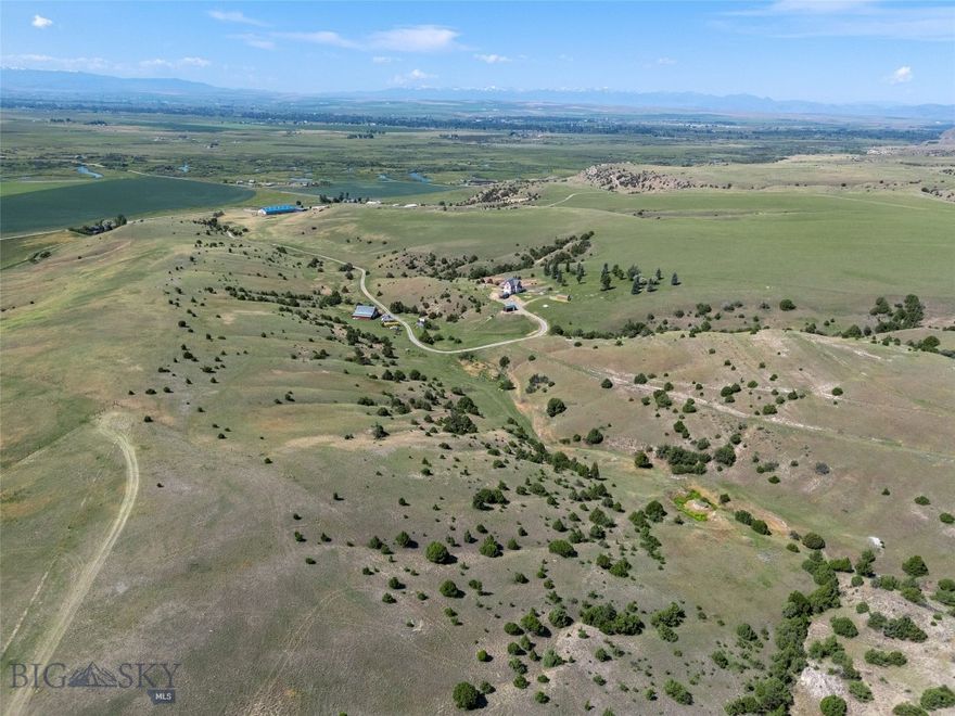 Set on 140± acres of open rangeland northwest of Belgrade, Hidden Spring Hills offers a rare chance to own a vast and unspoiled piece of the Gallatin Valley—an increasingly scarce opportunity in a region undergoing rapid development. This land is the main event: wide horizons, unobstructed mountain views, and a quiet that speaks to what Montana once was. Minimal covenants. No HOA. No commercial encroachment. Just space, sky, and possibility.
Beautiful rolling acreage with water rights (a 350 gpm irrigation well stands ready for a future owner to put water to work) and southern exposures offers pasture land for horses and livestock as well as space for all of your recreational needs– horseback riding through sunlit meadows, hiking hidden trails, sledding down snow-covered hills, cross-country skiing, or quietly observing the rhythm of wildlife in every season. Develop your own trails or follow the game trails that take you past distinctive rock outcrops, a small hidden natural spring, ravines and meadows sheltering wildlife, birds, flowers, and native grasses. 
At the heart of the parcel stands the historic Quaw Mansion– a Queen Anne landmark built in 1892 and relocated here decades ago as part of a preservation effort. The structure has been stripped to the studs and has roughed in plumbing and electrical. Its architectural bones and period details remain, waiting for a future owner to restore its legacy or reimagine its footprint. A fully finished walk-out basement provides comfortable living quarters while plans for the upper levels take shape. A detached 40'×40' shop adds valuable space for equipment, toys, or staging a renovation.
Indulge in blue-ribbon fishing on the East Gallatin River, just three minutes away, or plan an adventure into the nearby Gallatin National Forest, offering big game hunting and camping. From the homesite, take in spectacular views overlooking the East Gallatin and the rural farms and ranches that sweep outward to meet the majesty of five surrounding mountain ranges.
With its scale, privacy, water, wildlife, and storied past, this property is ideal for someone seeking solitude, long views, and a tangible connection to the valley’s heritage—before the subdivisions, before the traffic, before the sprawl. Whether preserved, rebuilt, or redefined, the land speaks for itself.