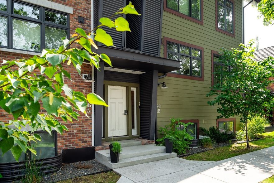 Lock it. Leave it. Love it!

One of Bozeman’s best in-town addresses. This Hawthorne Place condo by architect Frank Cikan delivers the best of downtown living without the noise. His thoughtful modern reverse floor plan elevates the living spaces for a tree-house-like view, spanning two levels and ~2,020 sq ft with 3 bedrooms (one converted into a fully built-out office), 2.5 baths, and finishes that feel intentional: white oak floors, quartz counters, GE Café appliances, and 9' ceilings on the main level. A covered balcony and heated tile floors in the lower-level bathrooms add the everyday comfort that makes a home easy to love. The lower level offers a private primary suite plus two additional bedrooms, while dual-zone heat and A/C with Wi-Fi thermostats keep things dialed in year-round.

One block from Main Street, enjoy a front-row seat to downtown Bozeman in a peaceful yet vibrant location. If low-maintenance living appeals, this home checks all the boxes. Fully furnished and turnkey right down to the silverware in the drawers and sheets on the beds. Quality proven management is already in place, just push the easy button. A detached heated garage and HOA-covered exterior maintenance, snow removal, and landscaping mean low overhead and minimal hassle.

As a bonus, this property could legally help pay for itself while you’re gone with Type 2A short-term rental licensing available as a primary residence (owner not required on-site during rental periods) in B3 zoning. Buy it and use it on your terms, and let it work in between. The operational foundation is already in place, this is a true turnkey opportunity in one of Bozeman’s most walkable in-town locations. Steps from everything downtown has to offer.