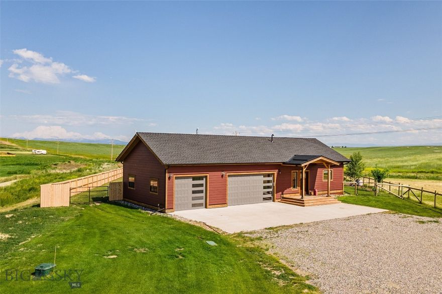 Nestled in a quiet cul-de-sac on 1.27 acres, this gorgeous single-level rancher offers 2,400 sq. ft. of beautifully crafted living space. Completed in 2021, this home features 3 bedrooms, 2 bathrooms, and a spacious three-car garage. Located in The Village at Elk Ridge, residents enjoy paved roads, a park, and breathtaking open views. This is the 4th home crafted with care in the community by this builder who brings specific skill and attention to building in the Three Forks area - please ask your agent for information on the specifics of this quality build!

Inside, an open floor plan designed for entertaining boasts custom doors, custom cabinetry, and true hardwood flooring throughout. The kitchen is a chef’s dream with a refurbished gas Wolf Range, a farmhouse sink, fantasy brown granite countertops, and a 9-ft butcher block island. A walk-in butler’s pantry provides ample storage and space for a second refrigerator or freezer.

The living room centers around a charming wood-burning stove, with seating areas oriented toward both the fireplace and the stunning backyard views. A large sliding glass door leads to a covered deck and a lush, fenced-in backyard with nearly 3,000 sq. ft. of grass. The master suite is a tranquil retreat with natural light, scenic views, a walk-in closet, and a spa-like ensuite with a glass and tile rain shower.

Outside, the widened gravel driveway provides ample parking, while a thoughtfully designed fence offers both privacy and unobstructed views. With an additional sprinkler zone ready for a garden, greenhouse, or chicken coop (yes, chickens are now allowed in this neighborhood!), this home is perfect for those seeking beauty, comfort, and functionality.

Don't miss the chance to own this exceptional property in a peaceful, friendly neighborhood!
