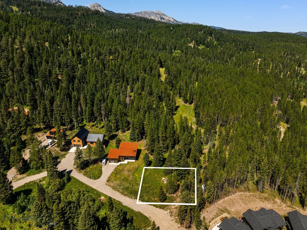Opportunity waits for a mountain home on this end of the road mountain lot.! Just minutes from Bridger Bowl Ski area & adjacent Crosscut Mountain Sports Center this lot offers an array of nearby outdoor opportunities. If you are looking for a ski-in-skin-out lot adjacent to Bridger Bowl, at a reasonable price, you better act fast. Only 15 minutes from Downtown Bozeman. Plenty of room to build on the 0.23 of an Acre, which feels much bigger with all the open space. Power, water, & sewer to the lot. All information is deemed reliable, but not guaranteed, buyers & agents to verify all information.