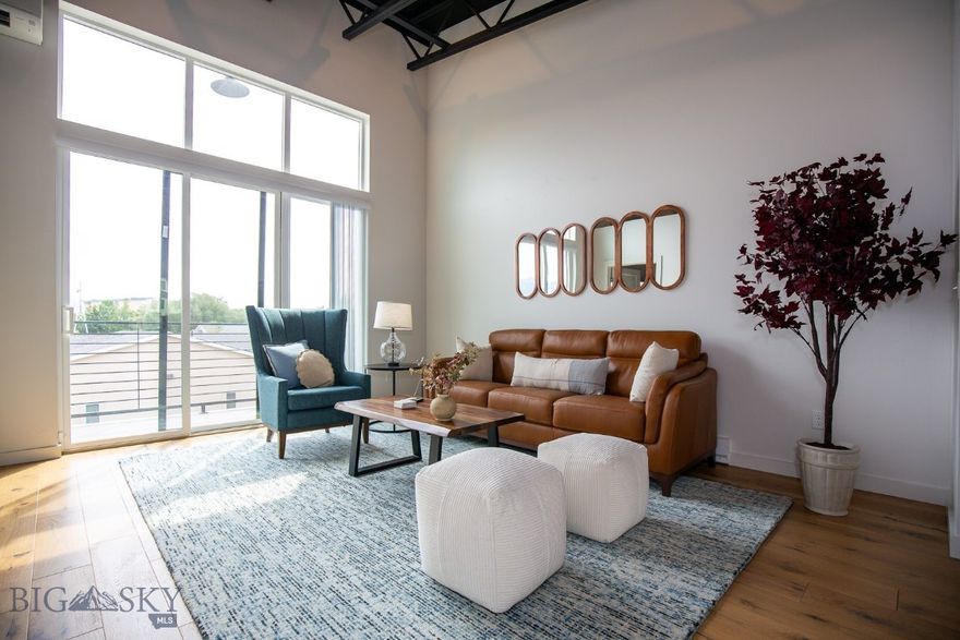 Super convenient work/live condo with big Bridger views is perfect for setting up business downstairs and comfortable living quarters upstairs!  The downstairs features over 800 heated square feet with a 10ft door, over 12 ft ceilings, and a half bath.  Perfect for a business, shop or to store the essential Montana toys and gear.  Upstairs is a modern loft with 1 bedroom 1 bathroom loft (think industrial chic) featuring fantastic views of Bridgers, finishes such as White Oak flooring, Quartz countertops, and Euro soft close cabinets.
Centrally located to all Bozeman and the Gallatin Valley have to offer, easy to hop on I-90 or take any of the main arterials to get where you need to go, quick.
This unit is a great price  and the furniture package as well as the all the outfittings for living are included!  Please call your agent and get in to see it now!