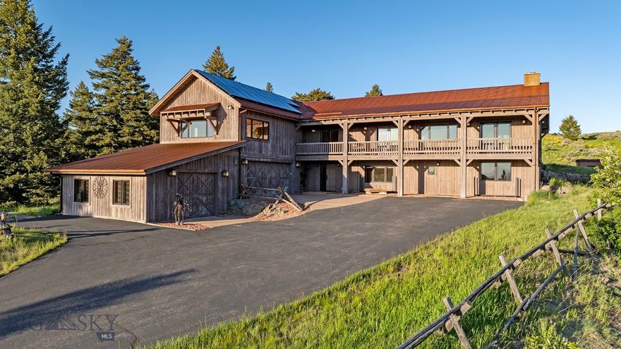 A Panoramic Mountain Retreat in the Heart of Kelly Canyon. Perched on 11.16 acres of pristine mountain terrain in the Bridger Range in Kelly Canyon, 2355 Sawmill Road offers a rare convergence of architectural elegance, energy-conscious living, and breathtaking natural beauty. This distinctive estate captures commanding southern views that span the entire Gallatin Valley, revealing Bozeman in full splendor beneath Montana’s boundless skies. With over 6,100 square feet of exquisitely curated living space, the residence is a study in comfort and craftsmanship. Vaulted ceilings and a wall of windows flood the interiors with natural light while framing the ever-shifting landscape. At its heart, a stunning Tulikivi soapstone fireplace radiates warmth and timeless character, anchoring the great room in both style and soul. The chef’s kitchen is a masterpiece of form and function—fitted with custom, highly organized cabinetry, top-tier appliances, and an expansive center island that invites connection and culinary creativity. Designed for both everyday luxury and effortless entertaining, the layout includes two spacious primary suites—one featuring dual bathrooms and an incredibly large closet —plus generous guest accommodations and a versatile lower-level ideal for a gym, media lounge, or home office. Freshly painted interiors create a bright and cohesive palette, while the seamless flow from indoor spaces to the back deck and front balconies offer a front-row seat to Montana’s legendary sunsets and starlit skies. Sustainably designed, the home boasts a 38-panel solar array that supports efficient living. Additional highlights include a three-car garage with dedicated storage, a charming carpeted bunkhouse/playhouse, a hot tub with panoramic views of the stars, and a two-story barn/shop with an integrated lift for effortless upper-level access. Set behind the trees yet minutes from downtown Bozeman, this is a legacy property where privacy, sophistication, and the outdoors live in perfect harmony—a truly one-of-a-kind mountain sanctuary.
