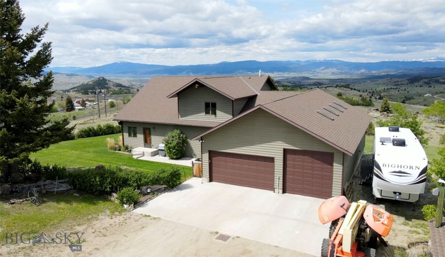 Welcome to your new home in Butte!  Nestled on a sprawling 6.98-acre lot, this meticulously maintained five bedroom, three bath residence offers an ideal blend of comfort and luxury, all while showcasing breathtaking mountain views.  The home features an inviting floor plan with vaulted ceilings that create an airy and spacious atmosphere.  Natural light floods the living areas, highlighting the thoughtful design and craftsmanship throughout.
The walk-out basement offers additional living space, perfect for entertaining or relaxing. The property includes a 34x34 pole barn for those in need of extra storage or workspace.  If you're looking to enjoy the serene surroundings on the outskirts of Butte, this home provides it!