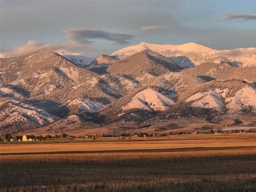Exquisite estate lot overlooking the Bridger Mountains. Minutes from downtown Bozeman and Belgrade.  The opened developement is designed to have unobstructed views for a quarter mile to the east. The twenty acre lot has gas and electric readily available. Covenants allow a domain home along with an accessory dwelling unit. The covenants are designed to protect  home owner investment and the view shed which has abundant wildlife, including: deer, antelope, pheasants, sandhill cranes and winter elk.  Plus several mountain ranges can be seen from the property. A private homesite in a quiet rural setting. Montana at its finest. There are only five lots (three still available).  Insignificant dues are limited to maintaining the firepond for the subdivision.  You will not find a more beautiful, accessable 20 acre lot in the Valley for this price. Two parcels have sold.   Experience the moods of Montana.