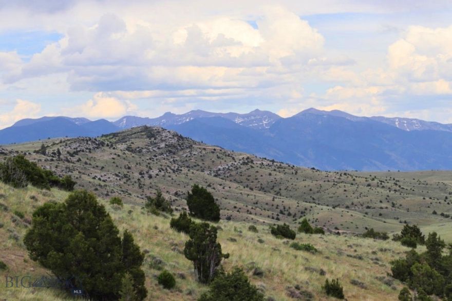 Panoramic Bridger and Absarokee mountain views, this 20+ acre parcel offers the perfect combination of privacy, accessibility, and natural beauty. Located in the Gallatin River Ranch community, this land offers an abundance of shared common area, so you’ll have all the space you need for hiking, exploring, and enjoying the wildlife that calls this area home. A mere 40 minutes from downtown Bozeman, 30 minutes to the Bozeman Yellowstone International Airport, and just 15 minutes to Manhattan. With 640 acres of state land just down the road, you’ll have access to even more space for recreation and exploration. Owners can enjoy the private 2.5-mile river access for fishing, floating, and summer BBQs with friends, including an exclusive picnic and fire pit area by the Gallatin River. With varied topography, this parcel offers endless possibilities for your dream build. Preliminary architectural plans are available from the seller with an acceptable offer, so you can hit the ground running. Utility connections—electricity is nearby, and the HOA maintains neighborhood roads, making this an easy place to build your Montana getaway.  This location gives you the ultimate outdoor lifestyle. Outdoor enthusiasts, nature lovers, and those seeking the tranquility of rural life, this is your chance to own a piece of Montana paradise. Embrace the beauty, adventure, and endless possibilities of life in Gallatin River Ranch—your dream home awaits! Some photos may include AI images & images from the Ranch's amenities and surrounding areas.