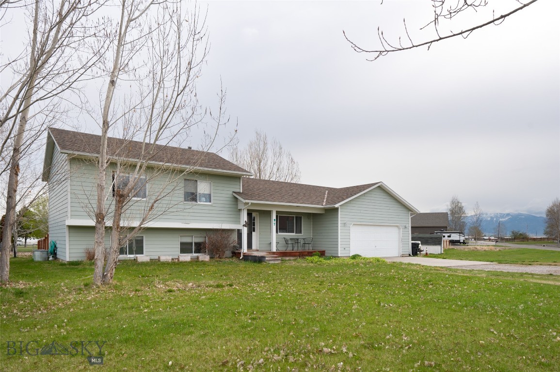 Enjoy this spacious one-acre corner lot with a private fenced backyard. The seller loves the privacy, location, space, and beautiful mountain views. The property has a large, newer privacy fence, playhouse, deck, and several trees in the backyard, plus a shed for tools on the front side. The covenants even allow for a shop to be built, per the approval of the design committee. This tri-level home is very accommodating with 4 bedrooms, an office, and a family room. However, these rooms could be used for your personal preferences, such as an exercise room, playroom, hobby room, etc. As you enter the front door into the living room, it flows to the dining area and kitchen with a pantry. The laundry room and an office/bedroom or flex room are through the kitchen. The upper level features the master bedroom with a private bathroom, two bedrooms, and another full bathroom. The lower level is a daylight basement with a possible family room, another bedroom, a utility room, and crawl space storage. There is a private well and septic, plus underground sprinklers. And finally, with the ample parking space of this lot, you'll have plenty of room for your RV's, boats, and other equipment for your Montana adventures. Less than 10 minutes to the airport, only 5 minutes to Erwin Bridge Fishing Access Site on the Gallatin River, just 34 minutes to Bridger Bowl Ski Resort, about 56 minutes to Big Sky, less than 90 minutes to Yellowstone National Park, and conveniently close to many trailheads in the national forest for you to explore pursuing all your outdoor activities (according to Google Maps).