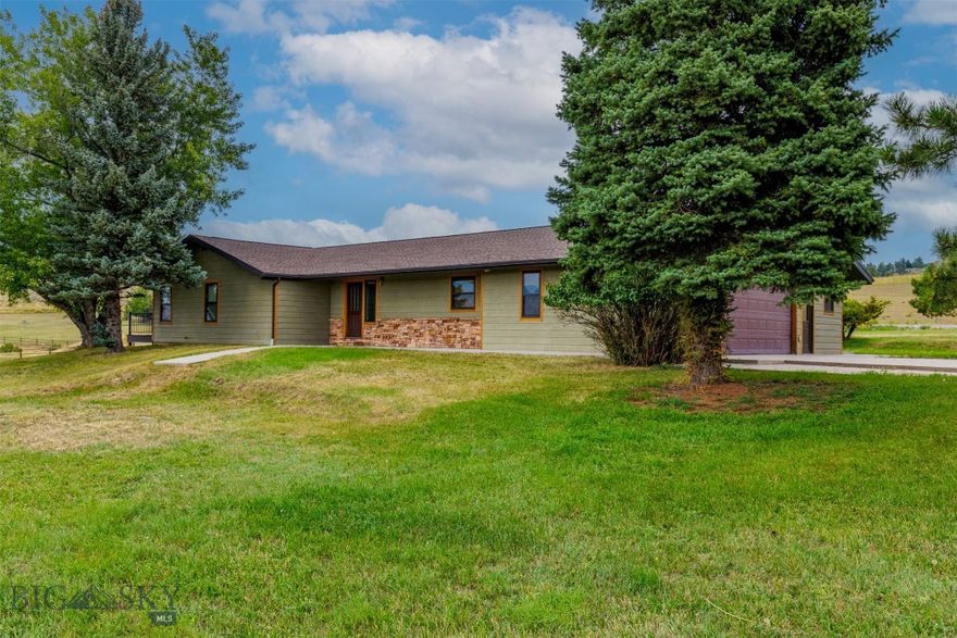 Discover privacy, comfort, and breathtaking views on nearly 2 acres. This well-designed home offers main-level living with an open-concept layout, spacious bedrooms, and a primary suite with Jacuzzi tub and direct access to a new deck. The lower level features a cozy wood-burning fireplace and flexible space ready to be transformed—ideal for a theater, game room, or additional living quarters. With water and a separate entrance, the basement could become an in-law suite or duplex. Additional perks include RV parking, a new furnace and A/C, and plenty of room for hobbies, toys, or animals. Info deemed reliable but not guaranteed. Buyer/buyer agent to verify.