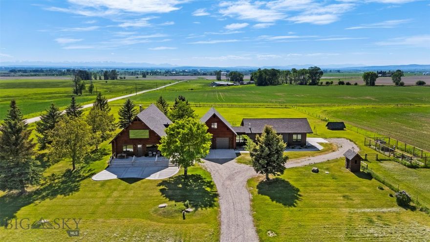 Experience refined mountain living in this extraordinary 8.6+/-acre estate, perched in Gallatin Valley's majestic Springhill area. Rustic elegance meets modern sophistication in this thoughtfully designed and recently remodeled custom log home. The main residence spans four bedrooms and three bathrooms, showcasing a main floor primary, soaring cathedral ceilings, and a stunning open-concept layout connecting the chef’s kitchen, dining, and living areas. Expansive windows frame panoramic views of the Bridger Mountains throughout the living spaces. Step out onto the expansive deck to enjoy unparalleled outdoor living—perfect for entertaining or savoring the stillness of the landscape. Upstairs, a large lofted family room with a private balcony offers an elevated retreat with commanding views. The basement provides two bedroom and versatility for remote work, library, or studio needs with two additional private rooms. Connected both from the outside or through an oversized 2-car garage, the meticulously built 1-bedroom, 1-bathroom guest residence (ADU), constructed in 2018 by ST Custom Homes, exudes modern charm and comfort. With its own full kitchen and living area, this residence is ideal for hosting guests, family or generating premium rental income. The entire guest suite and attached single car garage is heated by radiant in-floor heat. Additional updates and features: Remodeled bathrooms on main level (2), new kitchen, new windows throughout, whole-house generator system with dedicated propane tank, new boiler (2025), new basement carpeting (2025), updated lighting, and rebuilt new roof on main house (2024) and expanded front deck and balcony. The estate’s 8.6+/- acres come with valuable water rights and plenty of room for equestrian pursuits, boutique farming, or simply enjoying wide-open Montana skies. With a location that feels worlds away—yet is about 20 minutes from Bozeman, Yellowstone International Airport, and Belgrade - this rare property offers the best of Montana living. Space, beauty, and a sense of place that is truly unmatched.