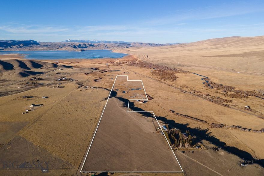 53± Acres with Ponds, Views, and Prime Access Near Public Land

Discover the perfect blend of open space, water features, and panoramic mountain views on this exceptional 53± acre property comprised of four separate legal parcels. The land offers a beautiful mix of native dryland and lush bottom pasture, enhanced by groundwater-fed ponds that create both visual appeal and practical use for livestock, recreation, or wildlife habitat. The property is perimeter fenced and features stunning views of Clark Canyon Reservoir along with sweeping vistas of the surrounding mountain ranges. With close proximity to public land, outdoor enthusiasts will appreciate convenient access to big game hunting, fishing, hiking, and year-round recreation. Minimal covenants provide flexibility and freedom, requiring only that the property be kept in a neat, clean, and orderly manner. Currently used for bird dog training, the ponds and open terrain offer excellent functionality, while the overall setting presents a true blank slate for your vision—whether that’s a recreational retreat, ranchette, homestead, or investment opportunity. If you’re looking for acreage with water, views, privacy, and access to Montana’s outdoor lifestyle, this property delivers outstanding potential in a highly desirable location.