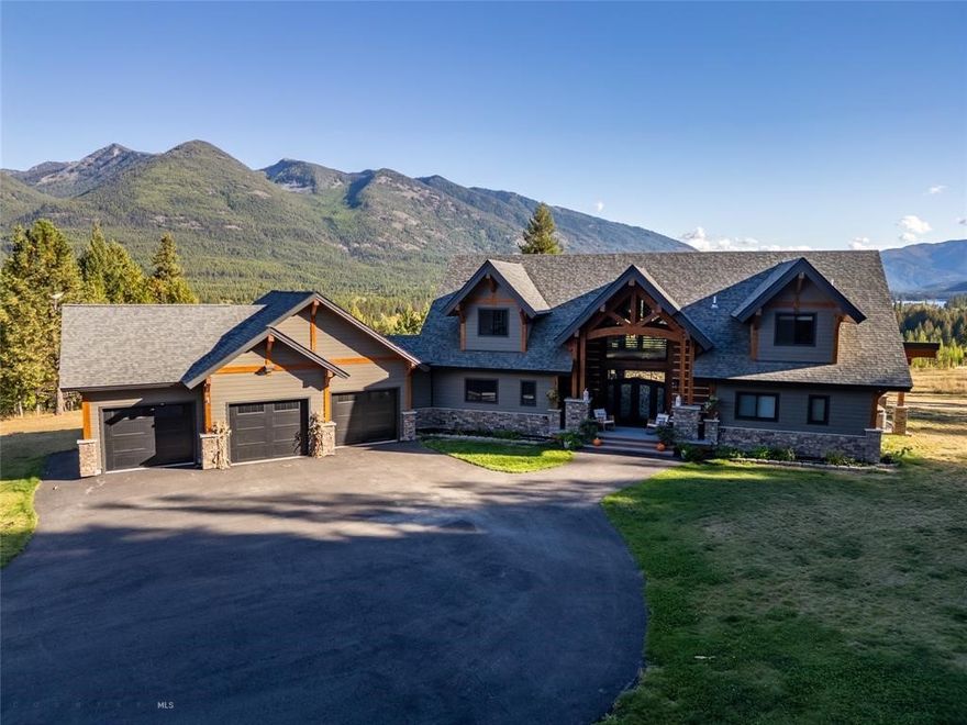 View of the Cabinet Mtns and Bull Lake from this top-of-the-line new home, finished in 2022. Timber frame and log home, on private 11 acres. 3 bedrooms, 3.5 baths. Open floor plan, with cathedral ceilings in the great room, fireplace & high-end finishes and views from each window. Kitchen has all Bosch appliances, Quartz counter tops, Large Dining room with drink/coffee bar in dining area, with great views. Wraparound deck for all your entertaining needs. Ensuite on main floor with full bath, walk in closets and double doors to the wrap around deck with fireplace and hot tub. Laundry room with lots of storage and coffee bar. Upper floor has home office, setting area and bedroom and 3/4 bath. Lower level has full kitchen, 3/4 bath, family room, wine cellar, bedroom and much more. Lots of room for all those family gatherings. 3 car attached garage. 40x60 fully insulated garage/shop with 14 ft doors. RV hook ups. 2 underground propane tanks, backup generator. Paved gated driveway.