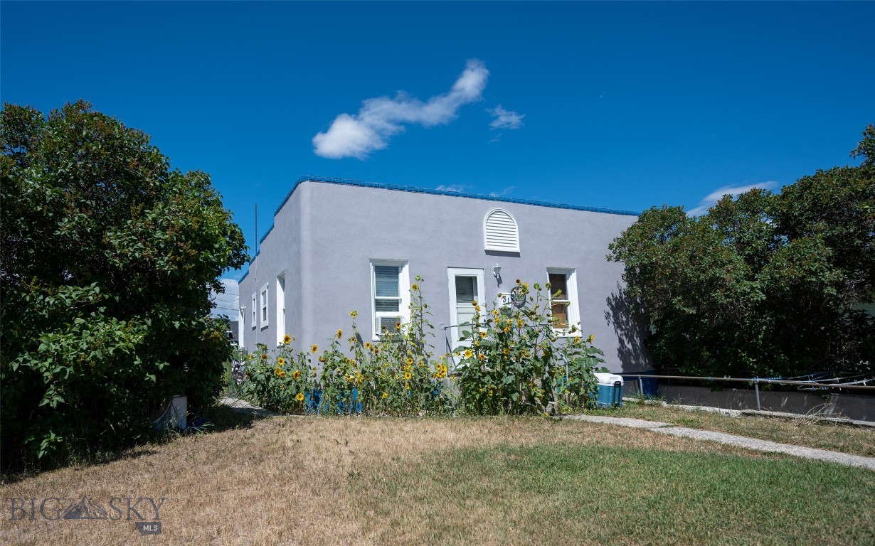 Looking for a cozy, move-in ready, starter home or investment property that is close to the university, the schools and downtown Dillon? Built in 1945, it features original hardwood floors and solid wood doors that highlight its vintage character. The downstairs basement has the laundry area and lots of space and storage. Step outside to a spacious, fully fenced backyard—perfect for your children or pets, or maybe some gardening. Mature lilac bushes frame the front of the residence, giving a sense of privacy, along with the wonderful scent of the lilacs in the spring. Call today for more information or to schedule a private showing!