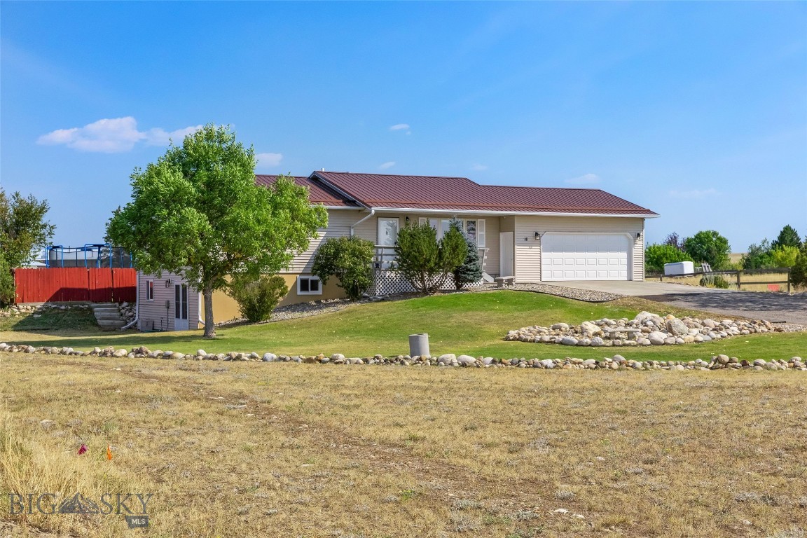 Comfort, space and modern updates! With a full recent remodel, this move-in-ready property is spic and span and ready for its next chapter. Welcome to this beautifully remodeled home on 1 acre tucked in a peaceful setting with plenty of elbow room, breathtaking views, and just minutes from downtown Big Timber. The main floor features 3 bedrooms and 2 full bathrooms with large living room and bright, inviting kitchen. Recent updates include a new kitchen with Cambria Quartz countertops, stainless appliances, wine fridge, and sleek glass tile backsplash. Downstairs, the full walk-out basement provides two additional bedrooms, a spacious family room with gas fireplace, and extra room for flex space - perfect for a craft space, workout studio, or home theatre. Throughout the home, new flooring has been installed, along with updated stylish lighting fixtures, classy bathroom upgrades, and new paint. Outside you will find gorgeous landscaping with mature trees and shrubs, fenced backyard, large storage shed, and even a basketball hoop with it's own court. These homeowners have loved living here and their pride of ownership shows throughout with its meticulous care and clean maintenance. Enjoy shooting hoops in the backyard or unwind in the hot tub. This property has space for both play and relaxation.