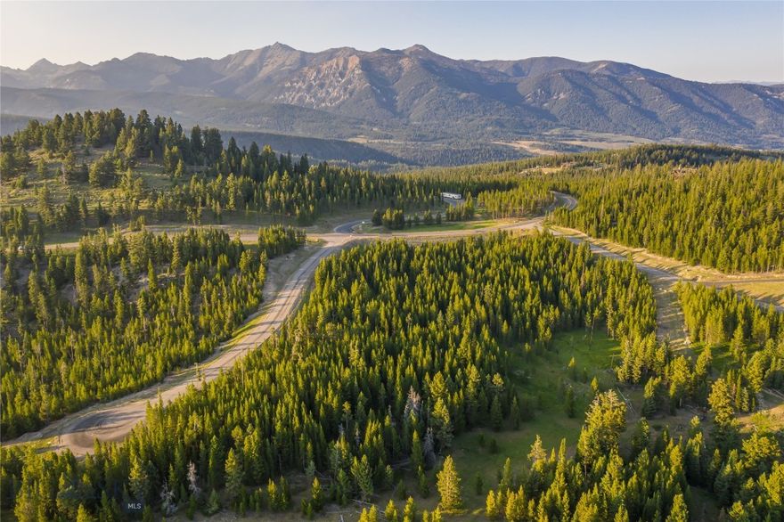 Build Your Dream Home in Wilderness Ridge at Spanish Peaks Mountain Club:  This stunning 3.54-acre homesite in the coveted Wilderness Ridge neighborhood of Spanish Peaks Mountain Club offers the perfect blend of privacy, natural beauty, and luxury amenities. Gently sloped with panoramic mountain views, the lot backs up to 36 acres of designated open space, ensuring peace and seclusion. Located on a quiet cul-de-sac with just six homesites, it's an ideal setting for your Montana retreat. Enjoy convenient access to world-class skiing, golf, and dining—just minutes from Montage Big Sky and the Spanish Peaks Clubhouse. After a day on the slopes or the links, return to your peaceful sanctuary surrounded by trees, wildlife, and breathtaking vistas. A Spanish Peaks Social Membership is available (subject to approval prior to closing), offering access to a wide range of amenities, including: Clubhouse with dining, bar, fitness center, pro shop, and locker rooms, Pool and hot tub with private access, Preferred access and discounts at Montage Big Sky and and Tom Weiskopf-designed 18-hole Championship Golf Course (with Golf Membership). Exciting Club enhancements are also underway, including the new Aspire Member Clubhouse and the recently completed 10-hole Par 3 golf course. There is no required timeline to build, allowing you to begin enjoying all the benefits of membership while you plan your dream home in Big Sky.