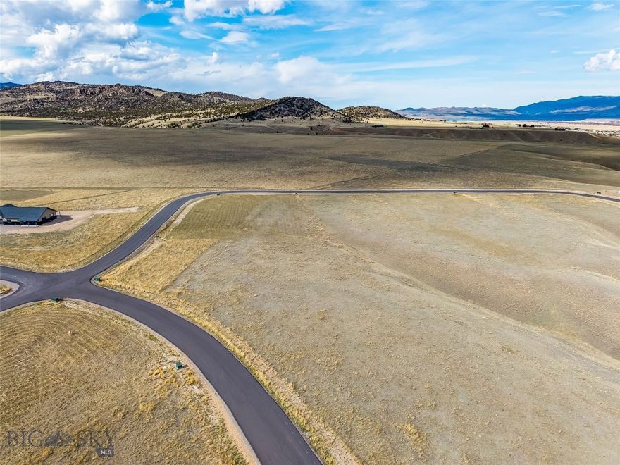 Discover the perfect blend of space, scenery, and convenience with this 1.96-acre corner lot in the newly developed Shadow Ridge Subdivision. Positioned to capture breathtaking, unobstructed views of the Madison Range, this property offers an ideal setting to build your Montana dream home. Enjoy the ease of paved road access and power already brought to the lot, making your building process that much simpler. As a desirable corner parcel, the lot provides added privacy, flexibility in design, and an enhanced sense of openness. Located just minutes from the charming town of Ennis and within a comfortable drive to Bozeman, you’ll have quick access to dining, shopping, and amenities while still enjoying the tranquility of rural living. Outdoor recreation is right at your doorstep...world-class fly fishing on the Madison River, hiking, hunting, and endless opportunities to explore public lands are all nearby. Whether you’re seeking a full-time residence or a seasonal retreat, this property offers a rare opportunity to enjoy big sky views and the best of Southwest Montana living.