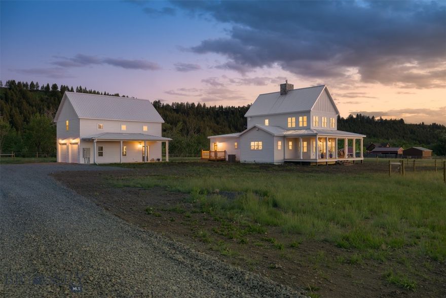 Discover your Montana dream at 992 Deer Haven Dr, an exquisite modern farmhouse on 38+/- acres with Cottonwood Creek meandering through. Located just outside Deer Lodge and ideally situated across from state land, this property offers unparalleled privacy, stunning views, and abundant wildlife.

Inside, you'll experience exceptional craftsmanship. The main level boasts soaring 9-foot ceilings and an open-concept living area, highlighted by a magnificent 19-foot, two-sided, hand-stacked stone fireplace, creating warmth and ambiance throughout. Exposed beams, extensive shiplap detailing, and unique hand-scraped pine wood floors secured with spike nails add character and charm. The gourmet kitchen is a chef's delight, featuring a massive, handmade pine farm table island, new stainless-steel appliances including a 48” dual-fuel gas range, classic farmhouse sink, and Dekton countertops. The living area seamlessly extends to a covered wraparound porch, perfect for enjoying the breathtaking scenery.

The luxurious main-floor primary suite offers a private deck entrance, a spacious walk-in closet, and a spa-like ensuite with floor-to-ceiling tile. A convenient half bath and bright sunroom complete the main level. Upstairs, two additional bedrooms and a shared full bathroom provide ample space.

The finished basement, with its 9-foot ceilings and painted concrete floors, expands the living area with two more bedrooms, a living area, a second laundry area/office, a full bathroom, and generous storage.

No detail has been overlooked for comfort and efficiency, including central A/C and a durable silver metal roof and a hot tub - awaiting for ultimate relaxation.

A significant bonus is the oversized, heated 2-car garage (with space for a third vehicle or workshop). Above the garage, accessed via a separate porch entry, are private guest quarters complete with a bedroom, full bathroom, and its own fireplace. For equestrian enthusiasts or hobby farmers, sits a spacious livestock barn.

Embrace the Montana lifestyle with creek frontage, abundant wildlife including moose and bear, and convenient access to recreational opportunities. This exceptional property offers the potential to be sold furnished for a turnkey transition.

A full listing description can be obtained in associated docs.