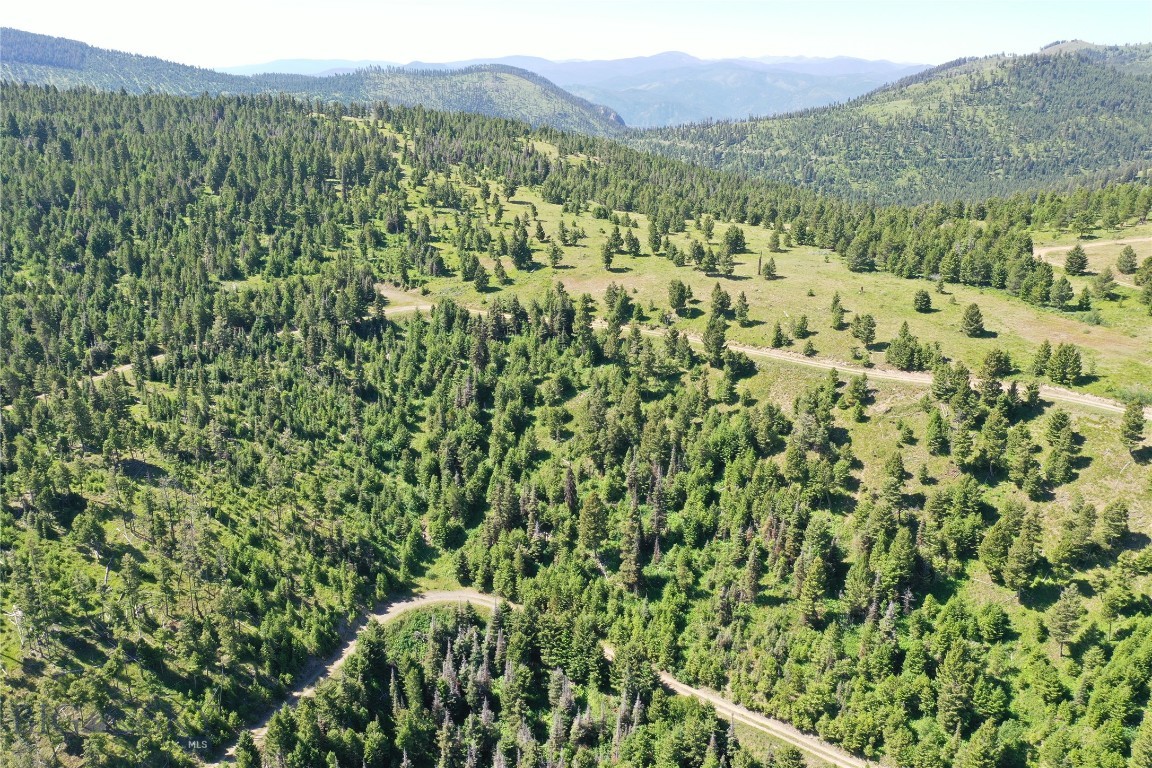 Off-Grid Montana Land for Sale – Garnet Range, Drummond MT Discover this stunning 158.4+/- acre property in the Garnet Range near Drummond, MT—a rare opportunity for those seeking Montana recreational land with true privacy and beauty. This off-grid property features seasonal springs, mountain views, and diverse terrain that includes wooded areas, open meadows, and rock outcroppings. Ideal for nature lovers, hunters, and those dreaming of a private Montana retreat, the land is home to abundant wildlife and offers excellent potential for horse property or secluded building sites. Located in Granite County, with gravel road access and no HOA, this is a piece of Montana acreage to create your own escape.