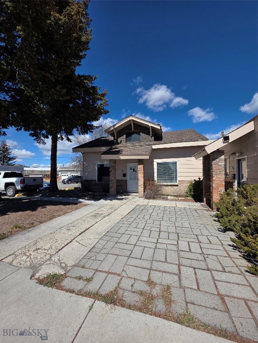 Prime Investment property in a Prime location!  This property has so much potential to be so many things.  This is considered a duplex with a detached 5 car garage, 3 bedrooms and 2 baths.  Come check it out, do your due diligence on the zoning, map out the location and bring your ideas to life!  Investors come bring your offers!