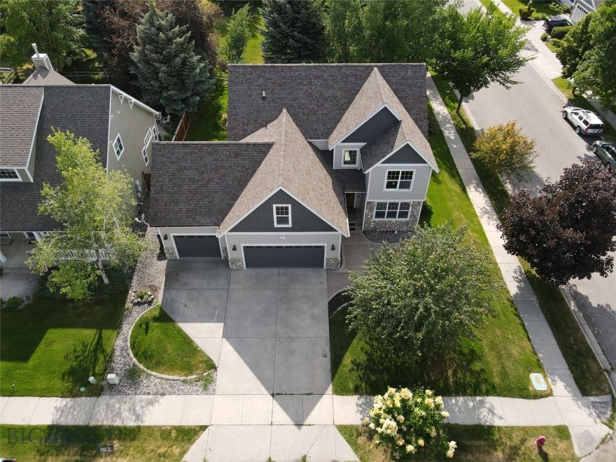 Centrally located in the delightful Harvest Creek subdivision, this 5 bedroom 3.5 bath single family home has recently been renovated boasting new high end quartz countertops, cabinets, flooring, and  Thermadore appliances throughout as well as a new floor plan that expands the living space on the main level to a more inviting and open floor plan accenting the vaulted ceiling.  You will love the main floor master with its custom finishes, jet tub, and natural stone shower.  A spacious three car garage is perfect for anyone looking for more room for storage for bikes, boards, skis, and other outdoor equipment, or workshop space.  This quiet corner lot with Bridger mountain views backs right into a wonderful park and trail system essentially extending your back yard into acres of recreational opportunities. Don't miss out on the opportunity to see this property!!