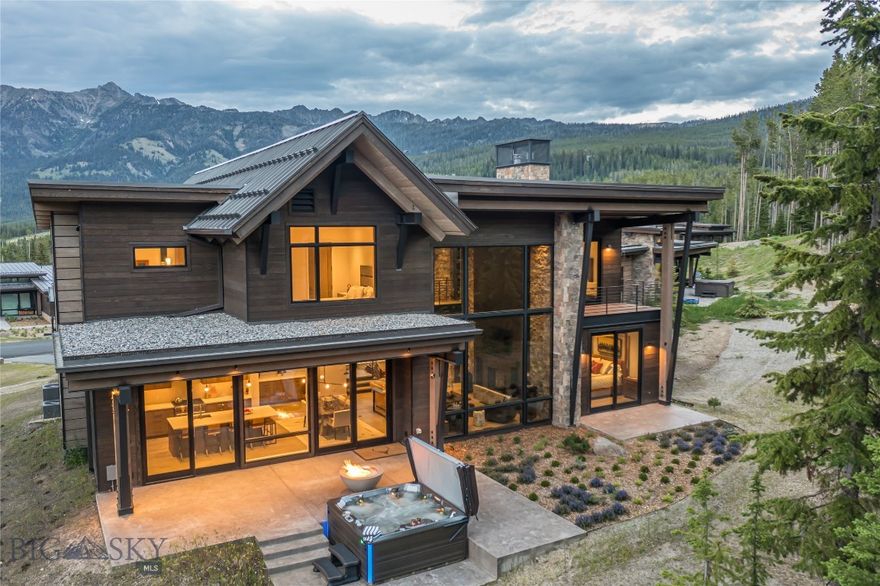 Surrounded by sweeping mountain vistas and the natural beauty of Moonlight Basin, this coveted Jack Creek Cabin at 8 Speedwell Drive offers an unparalleled opportunity to experience Big Sky’s most coveted alpine lifestyle. Designed by renowned Reid Smith Architects, this residence embodies a refined yet rugged contemporary aesthetic, seamlessly blending modern architecture with rustic elegance.

This inviting retreat is distinguished by sophisticated finishes, truly warm and welcoming interiors that bring the outside in. Expansive windows frame breathtaking mountain views, while soaring ceilings and natural materials create a sense of effortless luxury. The open-concept great room is anchored by a striking stone fireplace, perfect for gathering after a day of adventure. The gourmet kitchen features Sub-Zero refrigeration, a Wolf range, premium cabinetry, and ample space for entertaining.

The thoughtful layout includes four spacious bedrooms—including a main-level primary suite—and beautifully appointed baths, providing comfort and privacy for family and guests alike. A generous two-car garage with a dedicated mudroom makes it easy to store gear after exploring the extensive private trail system or the world-class skiing at Big Sky Resort, just moments from your doorstep.

Owners enjoy effortless access to everything Moonlight Basin. In winter, Big Sky Resort's remarkable ski terrain is just steps away via Jay Hawk Lift and Dodgeball Ski Trail, or claim a private ski locker at the nearby LakeLodge. Come summer, step onto scenic hiking/ biking trails that wind through pristine alpine landscapes. The home is an easy stroll to Moonlight’s LakeLodge and Ulery’s Lake Camp, where you’ll find dining, fitness, pools, and lakefront activities. Just a short drive away, Moonlight Lodge welcomes you with additional dining, après-ski gatherings, and community spaces, while The RESERVE—Moonlight’s celebrated Jack Nicklaus Signature Golf Course—promises unforgettable days on the fairways.

For even more adventure, the vibrant shops and restaurants of Big Sky’s Town Center and the blue-ribbon waters of the Gallatin River are only 15 minutes away. Beautiful Bozeman and Yellowstone National Park are just over an hour’s drive for endless exploration.

Experience the elevated lifestyle and stunning ease of this Jack Creek Cabin—an extraordinary opportunity in Big Sky’s premier mountain community.
