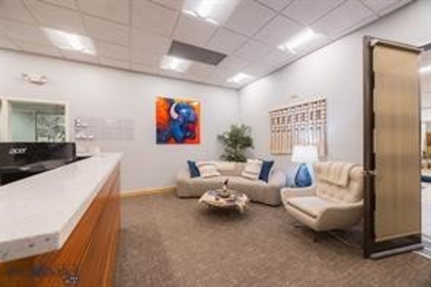 This listing presents a rare opportunity to acquire an established wellness-centered office collective with synergistic health and wellness tenants already in place. The offering spans approximately 3,311 square feet across Units F and G and includes 11 treatment rooms along with a spacious studio designed to accommodate a wide variety of wellness classes, educational events, and practitioner-led gatherings.  There is also an opportunity to expand the footprint through the additional purchase of adjacent Unit E, which offers 1,400+ additional square feet and seven more office suites, bringing the total combined space to approximately 4,732 square feet.  Unit F serves as the primary reception and waiting area and features a bright, open layout with a front desk, attached kitchenette, six treatment rooms, and additional storage space. Double doors open to a covered deck with beautiful south-facing mountain views.

Adjacent Unit G includes a large studio space currently utilized for wellness practices, formal classes, workshops, and educational gatherings. This suite also features five treatment rooms, a storage closet, sink with granite countertops, cabinetry, and oversized double doors leading to a covered deck with stunning northeastern views of the Bridger Mountains.

Located across the hallway, Unit E consists of seven additional treatment rooms primarily occupied by wellness practitioners and may be purchased separately or together with the existing offering.  

The HOA is in strong standing and has recently completed significant exterior improvements. Additional property amenities include elevator access to the second floor, shared common-area restrooms, individual air-conditioning units within each suite, extensive on-site parking with more than 20 designated spaces, and abundant off-street parking for clients and guests.  This is a compelling opportunity for an owner-user, investor, or wellness entrepreneur seeking to expand or establish a wellness-focused business with existing infrastructure and tenant synergy already in place. While preserving the current wellness-centered environment could be highly beneficial, the property also offers flexibility for a wide variety of professional or commercial uses.