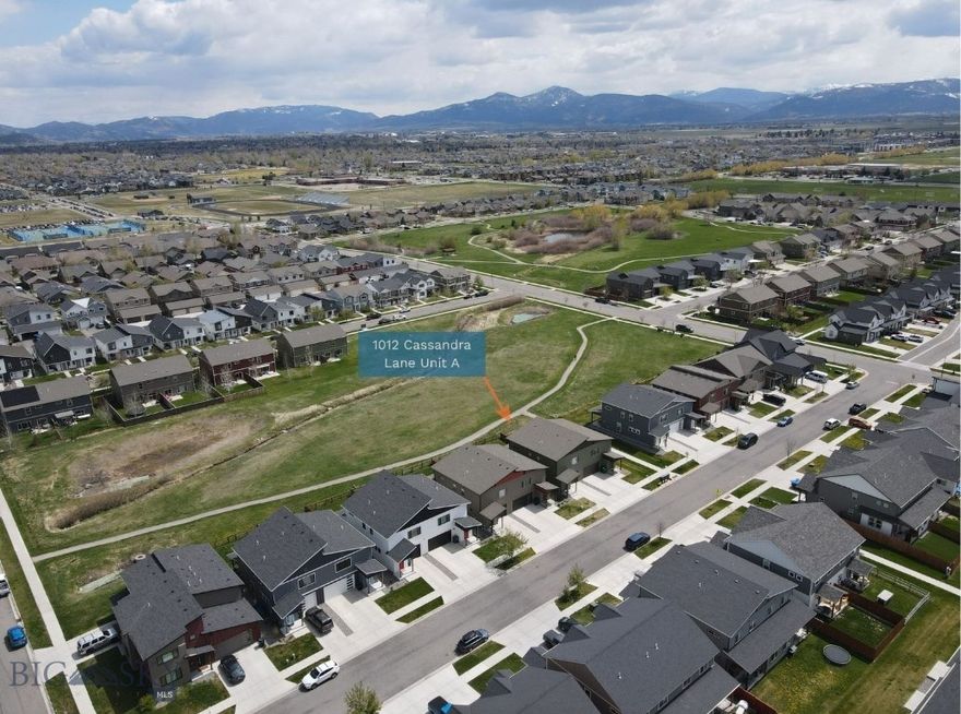 Welcome to this beautifully positioned 1,857 sq ft end-unit condo that truly lives like a townhouse. Backing directly to open space and the subdivision’s park area, this home offers a rare sense of privacy, extra breathing room, and unobstructed Bridger Mountain views—right out your back door.

The thoughtfully designed layout features an open-concept main level with a spacious living area, kitchen, and dining space that flow seamlessly together—ideal for both everyday living and entertaining. A convenient half bath completes the main floor. Upstairs, you’ll find three well-sized bedrooms, including a comfortable primary suite, along with two full bathrooms.

Additional highlights include a functional laundry/mudroom just off the attached one-car garage, perfect for Montana living, the added natural light and quiet that come with being an end unit, and a private fenced back yard.

Located close to parks, trails, schools, and all that Bozeman has to offer, this home combines comfort, convenience, and an unbeatable setting.