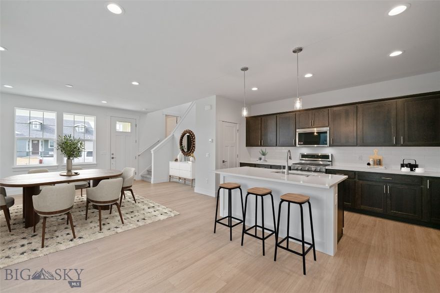 From the moment you walk into this home, it is clear that it is a space built for enjoying the best of indoors and outdoors. Right from the front door, you are led into the large great room, which is open and spacious enough for game nights, movie viewing parties, or just relaxing after a long day (of work or maybe skiing). The open floor plan leads into the dining room and kitchen — the latter of which includes a gorgeous kitchen island that is perfect for serving your guests breakfast on Sunday mornings. Upstairs, you will benefit from the ample space available in each bedroom. Two of the three bedrooms have spacious walk-in closets, and the two upstairs bathrooms offer privacy and comfort for all. Whether you have each bedroom filled with loved ones or have extra space for a home office, craft room, or home gym, you will be able to design the ideal space for your desires in this residence.  Must see to appreciate.

Features of this home include:
- Satin Nickel Hardware
- Upgraded KitchenAid appliances (fridge not included)
- Beautiful dark stained cabinets
- Quartz countertops
- Fully tiled shower walls
- specious side yard for gardening, entertaining or grilling