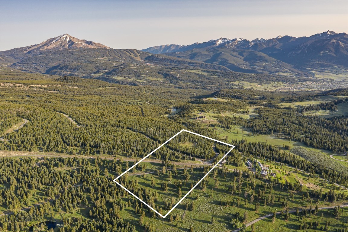 Discover the Pinnacle of Refined Mountain Living at Big EZ Estates – Lot 21
Nestled within the exclusive Big EZ Estates, Lot 21 offers an extraordinary 20-acre sanctuary, providing the ultimate blend of privacy, luxury, and natural beauty. This rare parcel is conveniently located just minutes from the heart of Big Sky Town Center, with paved road access and secure, gated entry, ensuring both privacy and convenience to neighboring private clubs Yellowstone Club and Spanish Peaks Mountain Club and minutes to the restaurants and shopping, farmers markets, concert series and rodeo in the Big Sky Town Center and 25 minutes to world class amenities of Big Sky Ski & Summer Resort.
Embrace awe-inspiring panoramic views of Lone Peak, Pioneer Mountain, and the iconic Spanish Peaks, where the landscape stretches in every direction to offer a visual masterpiece at every turn. Whether you’re imagining a serene private residence or an exceptional mountain retreat, this stunning lot serves as the perfect canvas for your Montana dream home.
At Big EZ Estates, exclusivity and tranquility come together in a community that celebrates both expansive natural landscapes and refined mountain living. With access to coveted amenities and a location that balances privacy with convenience, this property offers an unparalleled opportunity to craft your own legacy in one of the most sought-after areas of Big Sky.
Don’t miss the rare chance to own a piece of Big Sky’s most coveted and private enclave. Schedule your exclusive tour today and step into the epitome of mountain luxury living.