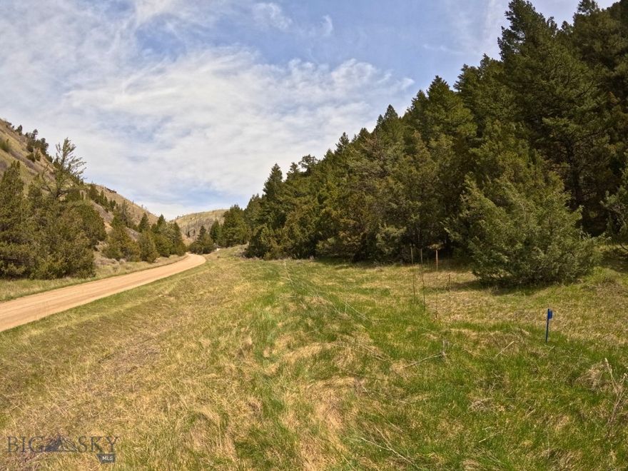 30+ acres of off-grid Montana land with year-round access, a natural spring, and multiple build opportunities—ideal for a cabin, basecamp, or hunting retreat. No covenants.

This property includes two adjoining parcels totaling 30.5 acres. The lower parcel (Lot 381: 10.2 acres) features approximately an acre of nearly level build sites along the road, with the balance offering hikeable terrain, timber, and elevated views.  The upper parcel (Lot 379: 20.3 acres) climbs to a more secluded setting with expansive, “top of the world” views, perfect for a second cabin, guest setup, or seasonal retreat.

The land is well-timbered with natural draws that attract wildlife, making it a strong fit for those looking to enjoy wildlife watching, hunt their own ground, or create a private getaway.

Access is available year-round, with the property located approximately 4.5 miles beyond the county road. Three Forks is about 25 miles away, with Bozeman Yellowstone International Airport approximately 37 miles and downtown Bozeman about 45 miles.

This is an off-grid property, well-suited for solar, generator, or alternative energy systems. A natural spring is located in a gully on the property and is shared with neighboring parcels. It is accessed via a short hike from the lower lot, leading into a unique, moss-covered draw that feels like its own secluded oasis.

If you’re looking for a place to unplug, spread out, and build something truly your own, this property delivers.