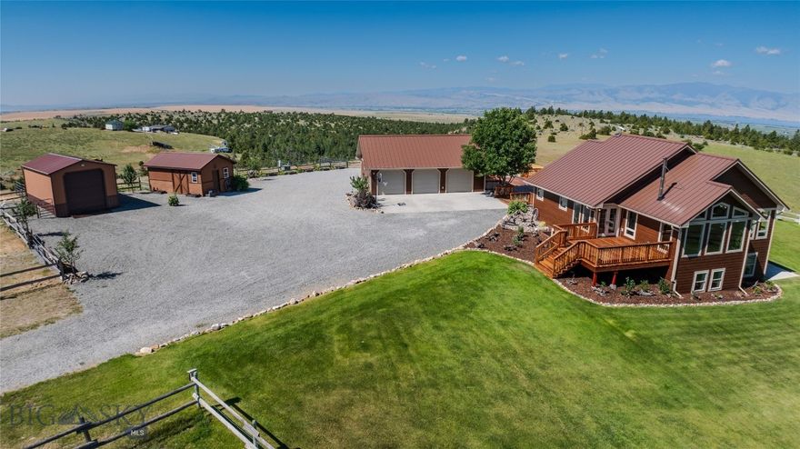 Welcome to 83 Big Country Drive, in Townsend, where Montana dreams do come true. What a gorgeous private 27.34+- acre horse property engulfed in 360 views & unbelievable sunsets with NO COVENANTS. This custom 2,838+- sq foot home offers 4 bedrooms, 2 1/2 baths, plenty of storage, & a beautiful kitchen overlooking the open concept living space with sweeping panoramic views. Efficiently built, this home has a gas furnace, an AC unit & a gorgeous wood stove. Within the last year renovations & upgrades have been made inside & out. A few of these custom touches are crafted rock work, new lifetime plank engineered flooring, texture & paint, trim, a wood stove, insulation, siding, metal roofing, soffit, facia, gutters, landscaping & high-quality redwood decking. Full views of Canyon Ferry Reservoir & the mountain ranges are incredible. Abundant wildlife habitat. The kitchen has great storage complete with a wall mounted oven & the JennAir stovetop, grill & downdraft ventilation. The living room is wrapped with picture windows absorbing natural light & panoramic views from the Townsend valley, Canyon Ferry Reservoir, the Elkhorn Mountain Range, Mount Baldy & all the way over to Edith. The redwood deck is accessed through the French doors with the BBQ gas line ready for summer dinners. The wood stove sits perfectly within the custom rock work offering warmth & efficiency. The walk out basement is beautiful with natural light shining through the large windows. The French doors open up to the patio & an above ground fire pit. The redwood deck has been sealed with linseed oil twice. This brings out the beautiful colors while protecting it from the weather elements. The garden was completed in the summer of 2024 with a custom-built greenhouse, above ground garden boxes & a wonderful low maintenance watering system. Which could easily be hooked up to the yard's underground watering system. The mature raspberries have provided gallons of berries while the chokecherry, plumb, cherry, pear & apple trees are growing and starting to produce. The garage is heated with a newer pellet stove and is fully insulated with storage, windows & a huge attic storage room accessed through the drop stairs. The shop is also insulated, finished & heated. Property is settled on the backside of private ranches & is within minutes of state, forest service & BLM land. It is approximately 15 minutes from Townsend, 45 from Helena & 1 hour from Bozeman. Owned by a licensed real estate agent.