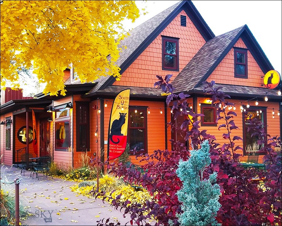Business-ready, completely renovated 3200 sq/ft of commercial/restaurant space, situated in a charming, turn-of-the-century house, adjacent to Montana State University. Zoned B1, the property includes parking and a 400 sq/ft detached apartment on its 7150 sq/ft lot. As a restaurant, the property is fully licensed (its Restaurant Beer & Wine License is available at an additional cost) and equipped to operate, comfortably seating 75+ indoors and 30+ seasonally outdoors. Both of the main building’s two floors may be used independently for private events; the second floor also offers a private dining room for 12. A new commercial kitchen was added to the main building as part of a complete property renovation executed between 2012 and 2014. The commercial kitchen features a 13 ft type-1 hood and 12-burner cook line, 900 cu/ft of walk-in refrigeration, 900 cu/ft of dry storage, a separate prep kitchen, floor-to-ceiling metal cladding of all vertical surfaces, and wall-to-wall Altro flooring with all-welded seams. In addition to the commercial kitchen, the main building’s totally renovated exterior features all-new Hardie siding and trim, energy-efficient doors and windows, roofing, and lighting, surrounded by all-new dyed concrete entryways and walkways, an illuminated patio, and full landscaping. The main building has been fully re-insulated top-to-bottom, with its completely renovated interior constructed atop all new plumbing, electrical, HVAC, and fire safety systems infrastructure. The interior features all new noise absorbent ceilings, walls and doors, staircases, lighting, flooring, and ADA bathrooms. The 400 sq/ft detached apartment’s renovated exterior, completed in 2021, features all-new Hardie siding and trim, energy-efficient doors and window; the interior includes a sleeping loft and remodeled full bathroom.