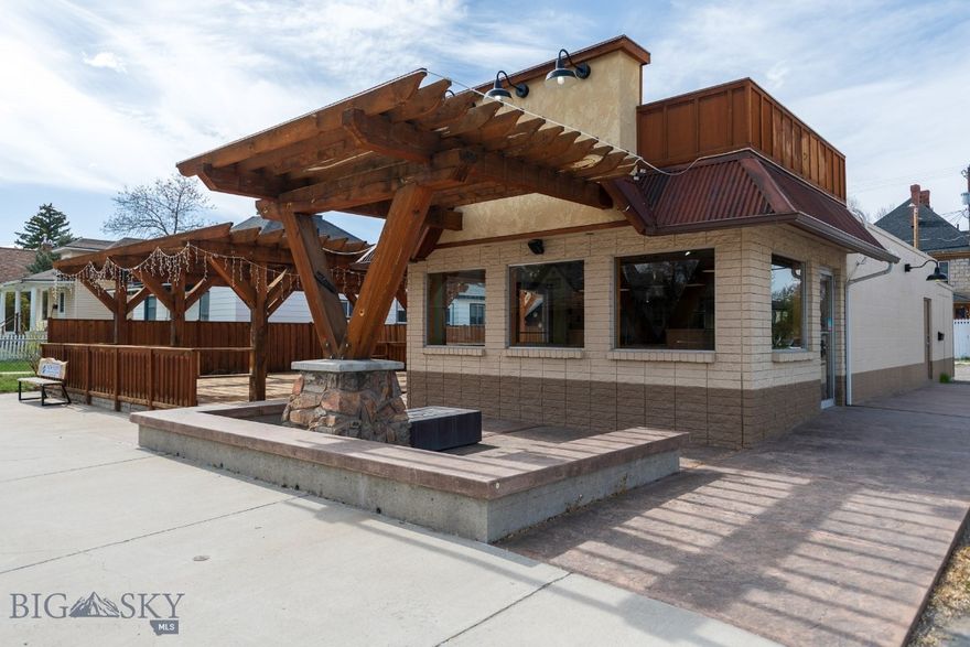 Prime commercial opportunity in the heart of Dillon, Montana—now offered at a newly reduced price. Located on South Atlantic Street, Dillon’s main commercial corridor, this 1,840 SF building sits on a .198-acre parcel just steps from the University of Montana Western, providing consistent visibility and foot traffic from students, faculty, and the surrounding community.

The property features a standout outdoor deck with pergola, paved parking, central A/C, and a functional interior layout ready for a variety of business uses. Formerly operated as a restaurant, the space offers a strong foundation for food service, retail, or other commercial ventures.

Ideal for an owner-operator looking to establish a presence in a high-traffic location, or an investor seeking a well-positioned commercial asset with multiple use possibilities. Low 2025 property taxes of approximately $2,503 and city water/sewer services help keep operating costs manageable.

Prime Commercial Location on South Atlantic Street—Dillon’s main corridor with strong daily traffic and visibility
Steps from University of Montana Western providing consistent foot traffic from students, faculty, and community
1,840 SF Turnkey Commercial Building on a 0.198-acre parcel with ample paved parking.
Former Restaurant Use with existing infrastructure in place—ideal for food service, retail, or flexible commercial use.
Class 1 Commercial Hood System with integrated fire suppression
Walk-In Cooler & Walk-In Freezer included—significant cost savings for restaurant operators
Natural Gas Forced Air HVAC with central A/C plus additional mini-split unit for enhanced climate control
Building Wired for Sound & Data—ready for modern operations and customer experience
New Roll-On Roof Membrane - providing durability and reduced near-term maintenance
Inviting Outdoor Seating Area featuring a custom pergola, gas fire pit, and outdoor lighting
City Water & Sewer Services for reliable utility infrastructure
Low 2025 Property Taxes (~$2,503) supporting favorable operating expenses
Flexible Use Potential—restaurant, retail, office, or service-based business
Owner-User or Value-Add Investment Opportunity in a growing Southwest Montana market