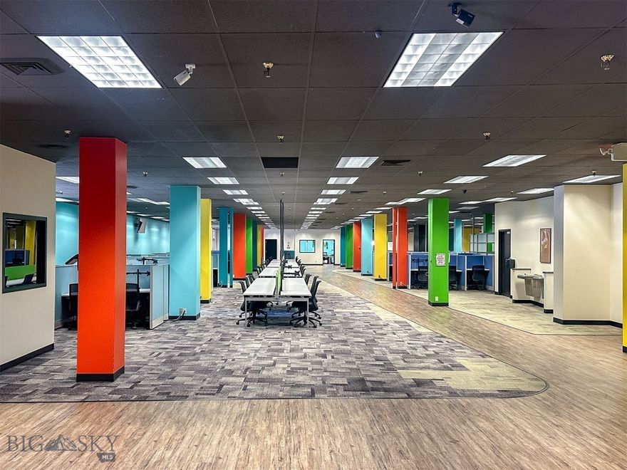 If you are looking for high visibility, and traffic counts in the downtown Great Falls core, this is IT! The modern AND historic building offers 7,754 sqft of floor space. Previously, the versatile space was leased to a call center, but would be ideal for retail, bar/restaurant/brewery, law firm, medical services, government, general offices, and so much more. Currently, there is a lobby, reception, seating areas, conference rooms, a full kitchen, dining space, bathrooms, and loading dock. Also, enjoy an extensive fiber optic system and uninterrupted power with a back-up generator. Previous tenant made over a million dollars in tenant improvements. Landlord can rebuild to suit and/or divide the space, if you do not need the full 7,754'. Covered and open parking available, but not included in lease price. Air cooling system in place. Dozens of office chairs, cubicles, televisions, kitchen equipment, other furnishings, shelving, monitor holders are available, but not included in the lease. Carpet and laminate are current floor coverings. Women's bathroom is handicapped accessible and has 10 stalls and 6 sinks. Men's is handicap accessible with 2 stalls, 3 urinals, and 3 sinks. Opening up the mezzanine would create 19 foot ceiling heights. Building formerly dubbed the historic Strain building and was once Sears. Building currently home to an event center, the bar Elevation, golf simulators, counselors, attorneys, and more. Property manager on site. Loading docks are currently shared, but landlord could convert to separate and private, if new tenant needs. Building is NOT FOR SALE. This is commercial lease only. Also, see additional space, for lease, on separate floors, under separate listing.