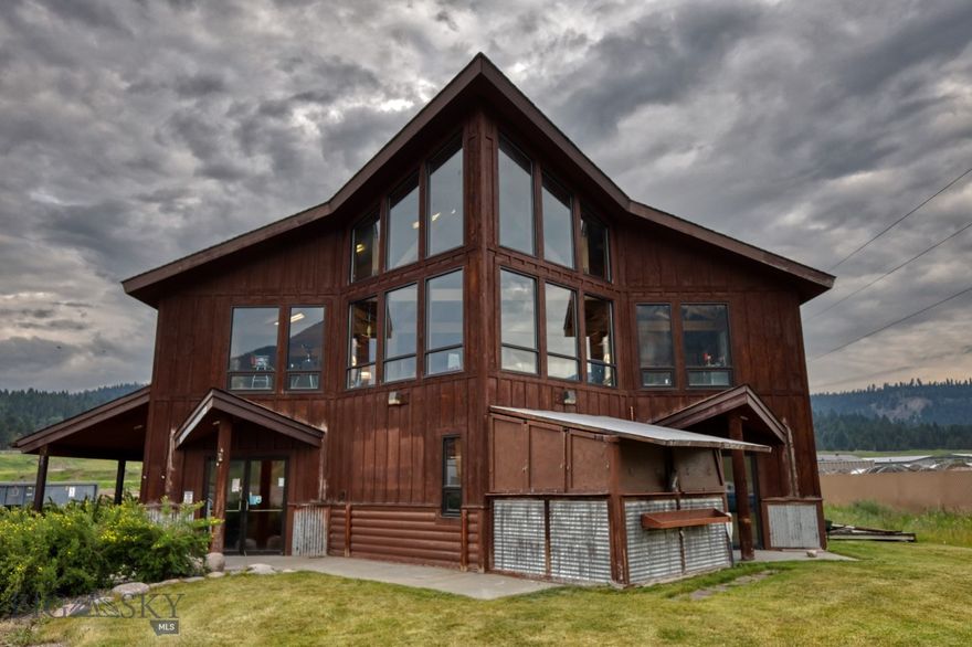 Presenting an exceptional commercial opportunity in the picturesque ski town of Big Sky, Montana. This expansive 6,268 sq. ft. building, set on a generous 0.6-acre lot, offers versatile space ideal for a range of commercial uses, from retail and office spaces to a hospitality venture. Strategically located across from the stunning Gallatin River and on the main road leading to Yellowstone National Park makes for a prime location. The property boasts stunning views of the surrounding mountains, providing a unique backdrop for any business.