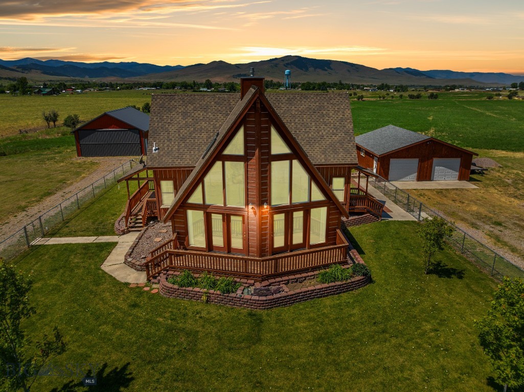 Welcome to your dream estate in St. Ignatius, Montana! This 4.65-acre property offers a harmonious blend of quality living, adventure, and natural beauty. With stunning views of the Mission Mountains, including the iconic Garden Wall, this property is truly one-of-a-kind.
The main residence features spacious, light-filled living areas with breathtaking mountain views, creating a warm and inviting atmosphere. The modern kitchen, equipped with impressive counter space, is perfect for culinary enthusiasts. Cozy and comfortable bedrooms are designed for ultimate relaxation, with the primary suite on its own level for added privacy. The deck provides an ideal space for entertaining guests or simply soaking in the stunning scenery.
The secondary home is perfect for guests or tenants, offering bright and welcoming living space, a functional kitchen with all necessary amenities, and comfortable, inviting bedroom. The bathroom meets your needs, including laundry facilities, and a fenced outdoor area of its own allows you to enjoy the mesmerizing surroundings.
The property includes a rare feature: platted access easement to the adjacent airport, presenting unique options. A detached garage and shop space offers additional storage and parking for vehicles or equipment. The expansive grounds offer plenty of room for gardening, outdoor recreation, or future expansion. Unobstructed, panoramic views of the Mission Mountains create a picturesque backdrop for everyday living.
Located in an inspiring setting, this property is also conveniently close to local amenities. You'll enjoy the intimacy of rural living, with Missoula just a 45-minute drive away, and the recreational opportunities of Flathead Lake are within easy reach, just 35 minutes north. Outdoor adventures abound, and a vibrant local community awaits.
This 4.65-acre estate is more than just a home; it's a lifestyle. Whether you're seeking a peaceful retreat with awe-inspiring views, this property offers a unique and unparalleled living experience. Don't miss the chance to own this extraordinary piece of paradise.