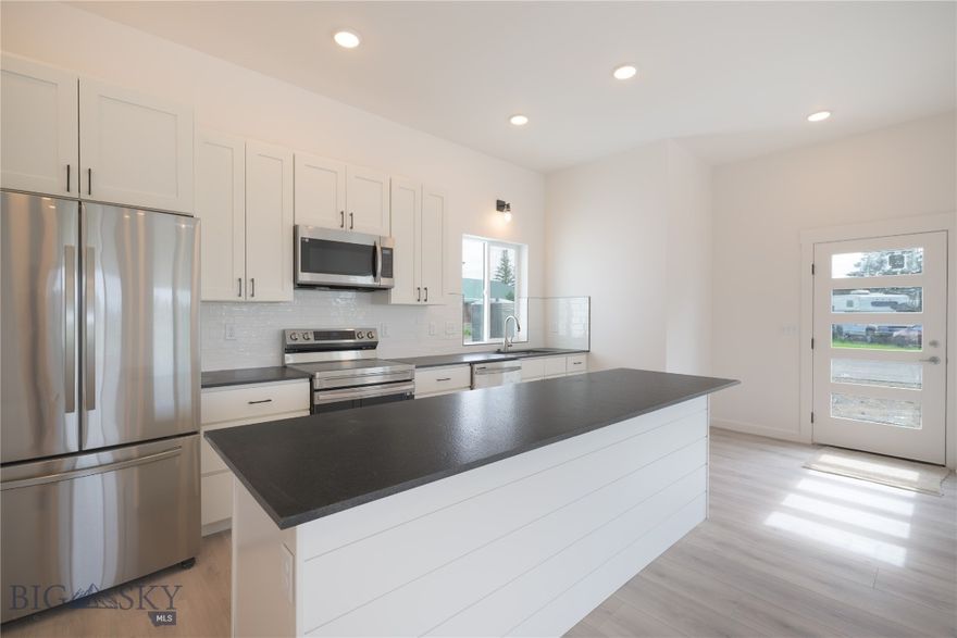 Discover a thoughtfully designed floor plan at 209 Pearl St. This home features a spacious open-concept kitchen and living area ideal for entertaining guests. The generous master suite boasts a walk-in closet and a beautifully tiled shower, providing a private retreat. You'll also find a spacious guest bedroom and a versatile bonus room that can serve as a home office or easily be converted into an additional bedroom. With 10-foot ceilings throughout, the home exudes a sense of grandeur and spaciousness. The convenient entry from the garage leads directly into the laundry room, offering extra storage solutions. This luxurious residence showcases sleek cabinetry, stunning granite countertops, and durable laminate flooring in the main living areas, complemented by plush carpeting in the bedrooms for added comfort. Experience the charm and elegance of this incredible home!
