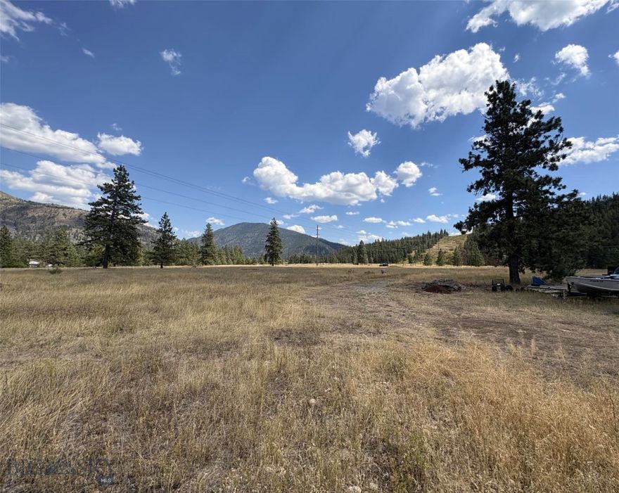 This 6.05-acre parcel offers a rare opportunity for residential or agricultural development only minutes from Missoula. Located west of the city along Deer Creek Road, Lot 4 is part of a larger tract currently in the subdivision process, with final plat approval anticipated in March 2026. Set in a peaceful rural environment, the property is bordered by Canyon RV & Self Storage to the west, undeveloped land to the north, and the Montana Rail Link right-of-way to the south. Zoned AGGR5, it allows for a variety of uses, including a single-family home, accessory dwelling unit, agricultural buildings, livestock, small-scale farming, and more. Electricity is available at the property, and the site offers convenient access for future infrastructure and development. If you’re looking for an investment, a homesite, or a versatile use property, Lot 4 combines natural beauty near the Clark Fork River with excellent accessibility to Missoula’s ever-growing market and amenities.