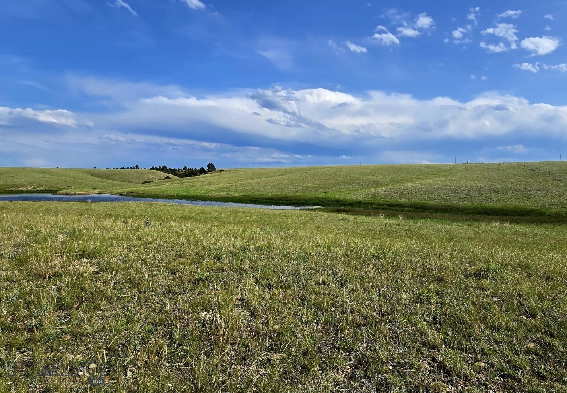 This 20-acre parcel in Shawmut, Montana features rolling hills and a private pond, making it a great spot for building, farming, or recreational use. Directly south of the property is over 650 acres of state land, offering additional space for outdoor activities and added privacy. The property is located about 25 miles from Harlowton, which offers essential services, and about 80 miles from Billings, the largest city in Montana. Billings provides full medical care, major shopping, restaurants, and an international airport. This is a great option for anyone looking for space and quiet, with convenient access to nearby towns.