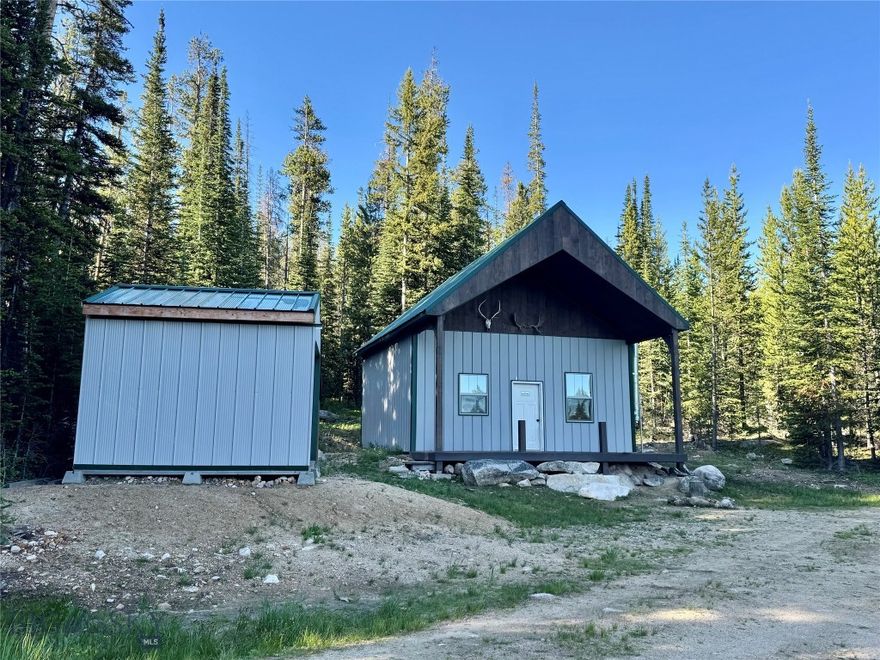 Escape the hustle and bustle and reconnect with nature in this charming off-grid cabin set on 3.94+/- acres! Tucked away in a peaceful and private setting, this cozy cabin offers seasonal access (or access with snow machine in the winter) and breathtaking views. The cabin is comfortably equipped with a propane generator for power, battery operated lights, a Unique brand off-grid propane range, flushable toilet and a wood stove to keep you warm and comfortable year-round. Spray foam insulation in the ceiling and walls keep it cool in the summer and warm in the winter. Featuring one bedroom and a sleeping loft there is plenty of room for the whole family! Perfect for weekend getaways or the ideal basecamp for outdoor adventures with Elkhorn Hot Springs, Crystal Park and Maverick Mountain being just a short drive away. Price Creek is just a stones throw away and the property is bordered by Forest Service land on one side. Enjoy the simplicity of off-grid living surrounded by natural beauty—whether you’re relaxing on the porch with a cup of coffee or sitting by the fire after a long day outdoors. Properties like this rarely come on the market, call today to make this your own Montana paradise.