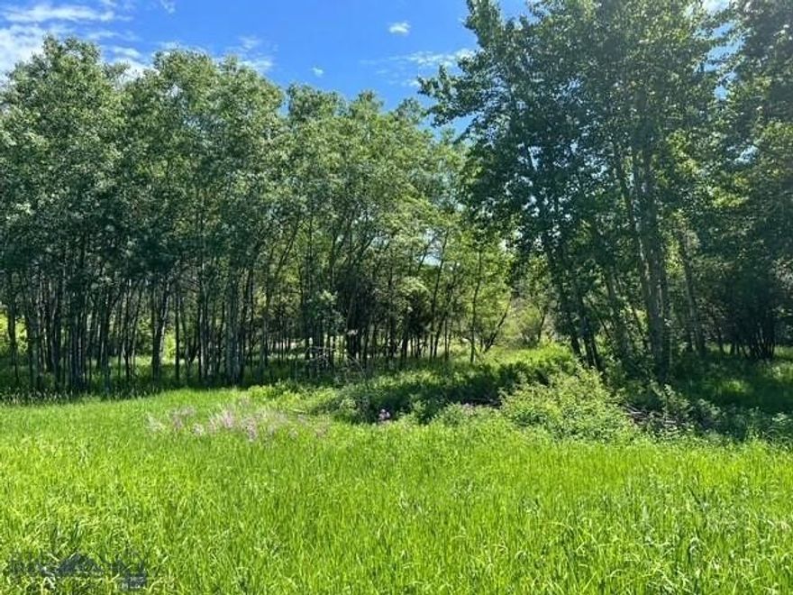Welcome to one of Bozeman’s most unique and picturesque vacant properties! Sitting at approximately 1.396 acres of natural Montana beauty, located within city limits, it will have you dreaming of the endless possibilities. This breathtaking property offers the perfect blend of privacy, natural beauty, varying topography and a prime location. This private, park-like parcel features a serene creek meandering through the backyard, surrounded by mature aspens and various other established trees that provide both beauty and privacy year-round. In addition to its tranquil setting, the property regularly welcomes local wildlife including black bears, abundant numbers of whitetail deer, various species of fowl and even the occasional wild turkey. Let’s not ignore the private tennis court (shared with adjacent property) that is currently on the property - options to remove or resurface, etc. This property is a rare blend of in-town convenience and a true connection to nature. With plenty of space to build your dream home, this lot is a rare find in Bozeman. Peaceful, scenic, such a variety and full of potential ~ take this opportunity to make it yours. Pictures do not do it justice ~ you need to see it with your agent to really feel the gravity of how amazing it is. Also listed as an option with adjoining 2.472 AC and house (MLS # 409414).  Please make note that this property is agent-owned.