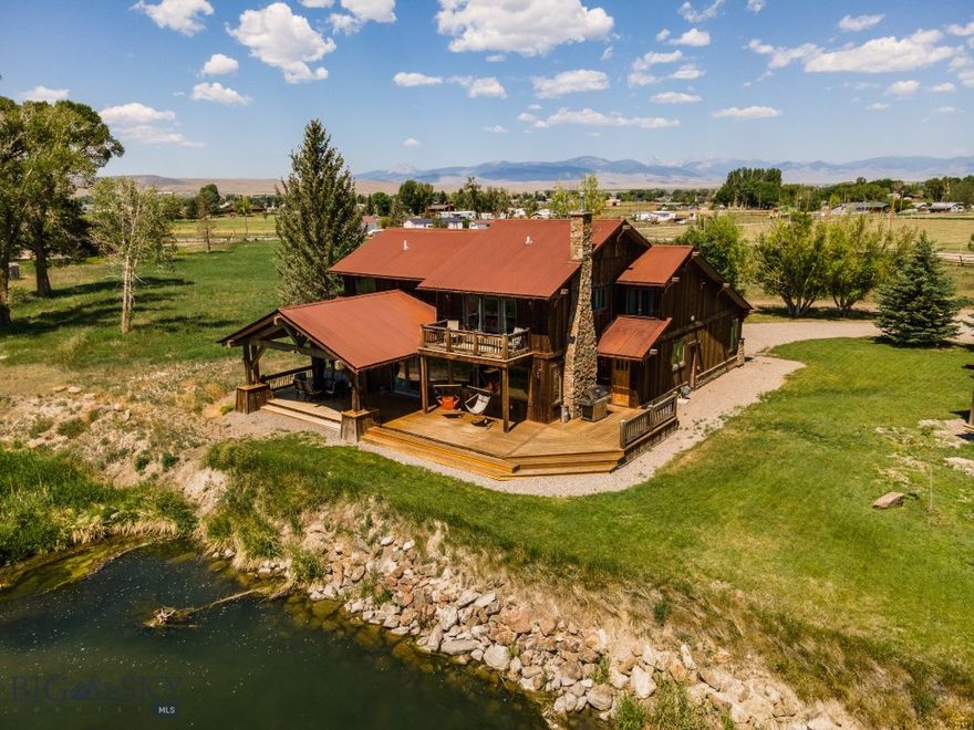 At the crossroads of where Yellowstone meets A River Runs Through It, this is an extremely rare piece of Montana beauty located on the Beaverhead River.  A private boat launch, the ability to cast your favorite fly off the deck, and within minutes of every amenity one could desire in Dillon, make this a unique once in a lifetime property.  Three airports are within a short two hour drive.  Complete with five bedrooms, a two bedroom guest house and situated on over 6.5 spacious acres, there is room for everyone.  The stone fire place is the perfect spot to gather and will warm not only your weary bones but also your soul.  The open floor plan of the main level is the perfect place to gather and share smiles and laughs alike.  World class fishing, waterfowl overhead and whitetail deer grace the property.  Breathtaking views of the Blacktail, Pioneer, and Tobacco Root Ranges make for awe-inspiring views.  The recent addition of mature trees add to the seclusion of the property and gives it a very private and tranquil feel.  Hard wood floors, tiled showers, custom cabinets and countertops add elegance with some western flair.  The property is serviced by a well, natural gas and septic.