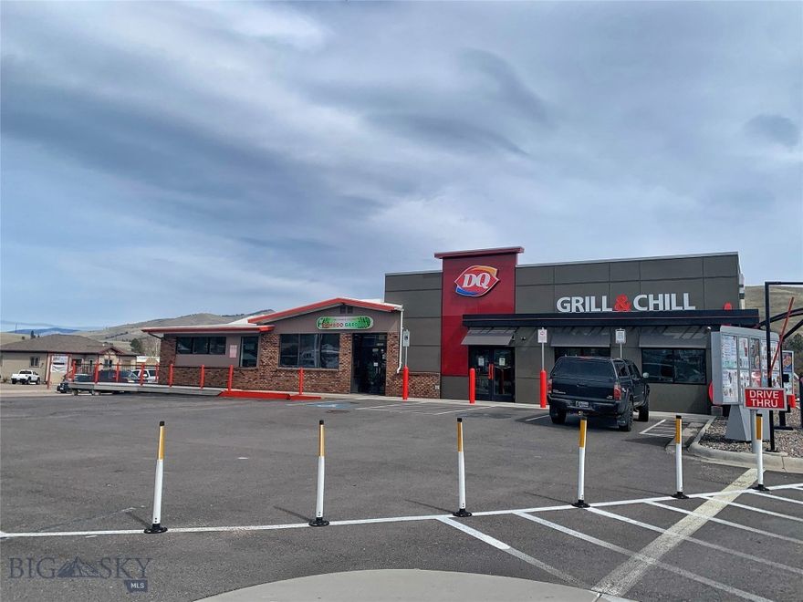 Explore an enticing investment opportunity at 11400 US-93, Lolo, Montana! This property offers a prime commercial space housing two successful food & beverage businesses: a Dairy Queen Grill & Chill and Bamboo Chopstix. Priced at $1,695000, this sale includes the building and land with long term tenants, providing a valuable investment opportunity in the heart of Lolo. Built in 1982 & remodeled in 2020 the property spans a total of 4612 square feet and features a convenient drive-thru for the Dairy Queen. Its strategic location along the bustling US-93 highway ensures high visibility and accessibility, making it an attractive choice for businesses. Investors can capitalize on the stability and income potential provided by two well-established tenants. With a combined lease agreement in place, this investment promises steady returns and growth potential.  
*Business's are not for sale. Sale is for land & building. Lease is a NNN lease. See documents for Offering Memorandum. Don't miss this unique opportunity to own a commercial property with established tenants in a prime location along US-93!