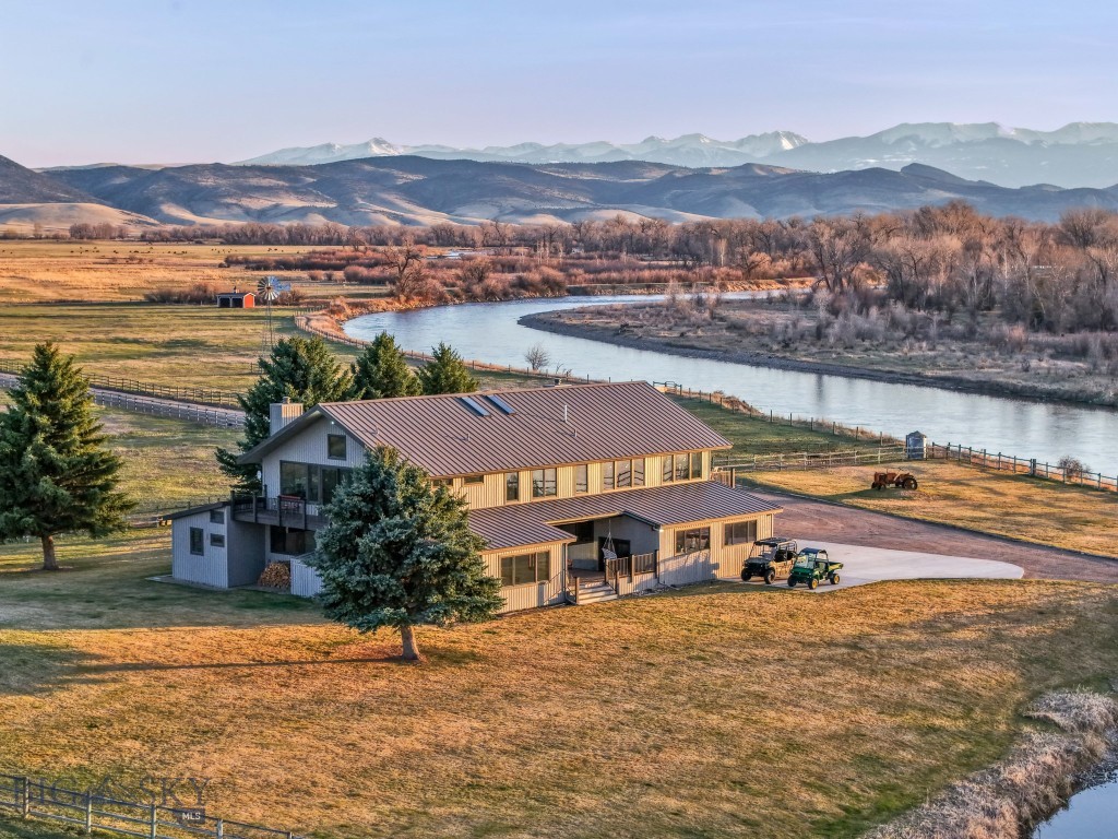 Opportunities like this are exceptionally rare—a stunning 368-acre estate with one mile of Jefferson River frontage, offering unmatched privacy,
beauty, and Western lifestyle. Set against the backdrop of three mountain ranges, this is a property where luxury and nature live in harmony. The
thoughtfully designed 4,710 sq. ft. custom home is exquisitely situated on the bank of the river, designed to capture the views and tranquility of the
setting. Inside, you’ll find 4 spacious ensuite bedrooms, 4.5 bathrooms, radiant floor heating, and numerous high-end upgrades throughout. There is
a separate entrance to guest quarters, as well as a 5-car garage which provides ample space for vehicles, toys, or storage. The land is a dream for
ranchers or recreational enthusiasts, with two 60-acre pivots, extensive water rights, three wells, and fully fenced. A picturesque barn, plus a
charming covered carriage bridge with power, add both function and character. This property supports a lifestyle we all dream about! With easy
access, this ranch offers endless possibilities—raise animals, grow your own food, or simply enjoy the abundant wildlife. Fish, float, hunt, or relax
under expansive Montana skies. Sunsets are simply spectacular. You’ll engage in this private setting, but also proximity to Willow Creek Cafe and
Supper Club, Bozeman airport, and all that Southwest Montana has to offer! It's the kind of place where you can hear yourself think, see the stars at
night, and still be close enough to town for a spontaneous dinner or morning coffee run. This property is not just a home - it is a rare and significant
piece of Montana heritage