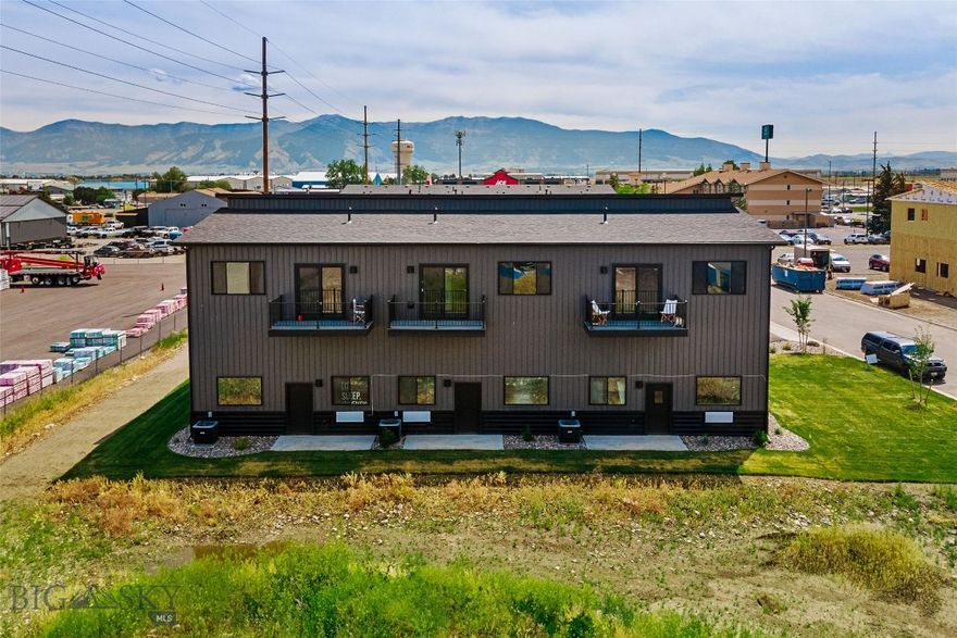 Leased live/work investment with immediate cash flow in the high-growth Jackrabbit corridor. Built in 2025, this modern mixed-use unit offers strong in-place income with future owner-user flexibility.
Unit A is leased at $49,200 annually through April 2027, providing stable income from day one. Ideal for investors seeking predictable returns or future owner-users looking to secure a high-quality space with income in place.
The ground floor features approximately 1,240 SF of commercial/shop space with a 12’ x 12’ overhead door, private office, and bathroom—well suited for contractors, trades, or small businesses.
Upstairs, the residential unit offers approximately 1,170 SF with two bedrooms, two full bathrooms, open-concept living, walk-in pantry, in-unit laundry, and a private balcony.
Live/work units of this quality are extremely limited in the market, with strong demand for flexible industrial/residential space. Low-maintenance, new construction in one of the Gallatin Valley’s fastest-growing commercial corridors.