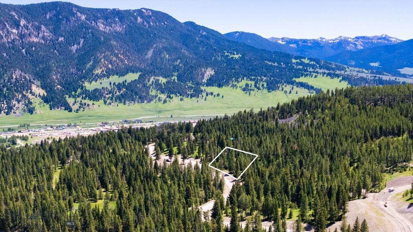 Gallatin Foothills Lot 30 is adjacent to the Terraflow biking and hiking trail and over 26 acres of open space and provides mazing views with mature trees. Its sloping lot is suitable for a walkout basement, offering both privacy and easy access to outdoor recreation. Introducing the final phase of Gallatin Foothills, where residents will revel in spacious lots ranging from 1 to 2 acres, complemented by over 75 acres of dedicated open space. Each homesite, complete with mature trees and privacy, has been meticulously selected and designed to capture breathtaking sunrise and sunset views, alpenglow, and expansive mountain vistas, all while remaining conveniently close to town amenities. Neighborhood amenities include world-class Terra Flow mountain biking trails, sledding hills, and parks with open spaces perfect for hiking and cross-country skiing. At the base of the development, a trail network provides access to public lands, ideal for snowmobiling, ATV riding, and mountain biking. Fishing enthusiasts will appreciate the incredibly convenient 5-minute access to the Gallatin River. A short drive brings you to Big Sky’s Town Center, Big Sky Resort, and an even shorter trip to Ophir Elementary School, Lone Peak High School, the Warren Miller Performing Arts Center, and countless trailheads and recreational opportunities.